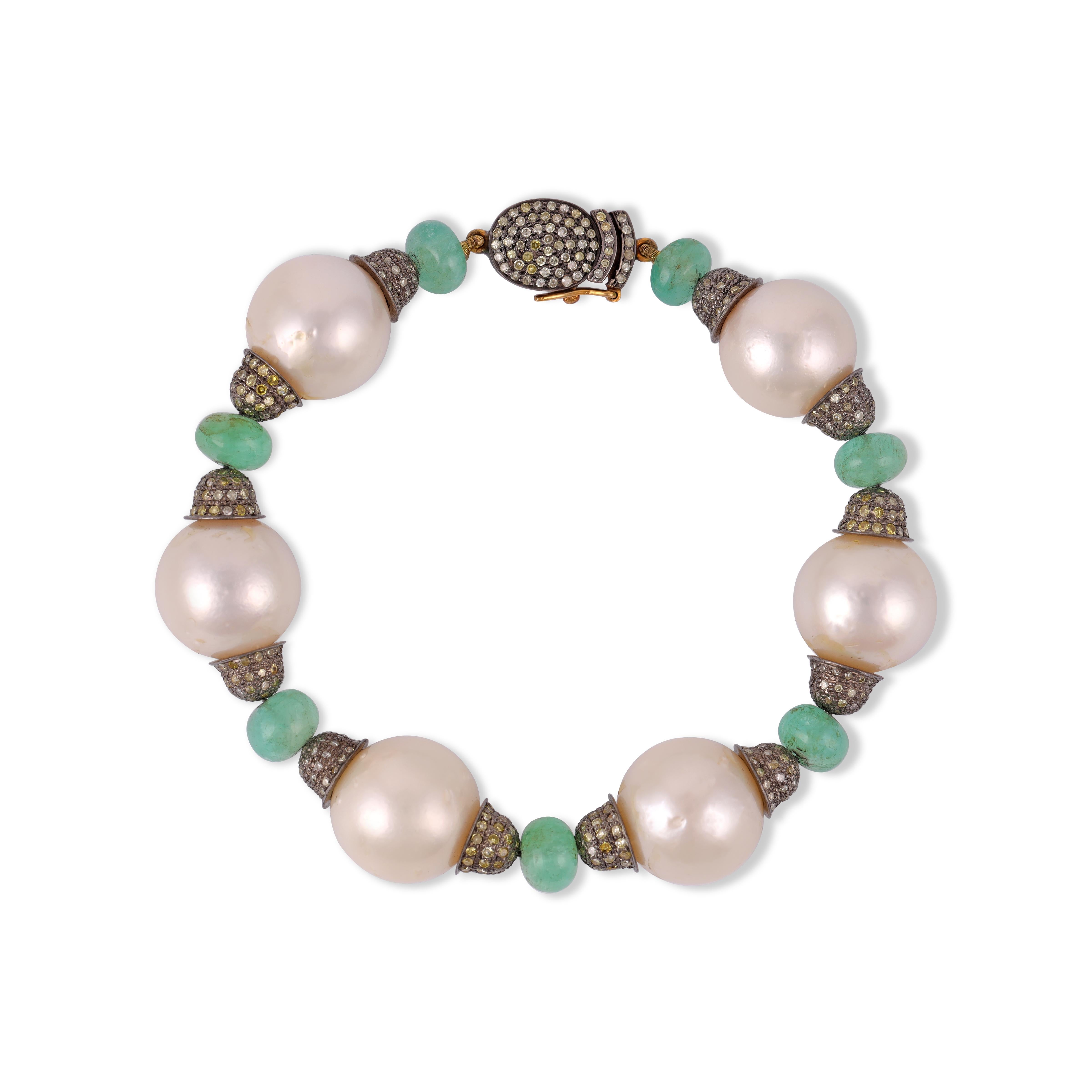 Magnificent Antique Pearl Diamond Emerald and Silver Upon Gold Bracelet
Pearl 118.41  Carat
Emerald 14.67  Carat
Diamond 2.84  Carat

Gold 0.61 gm
silver 8.77 gm 


Custom Services
Resizing is available.
Request Customization

