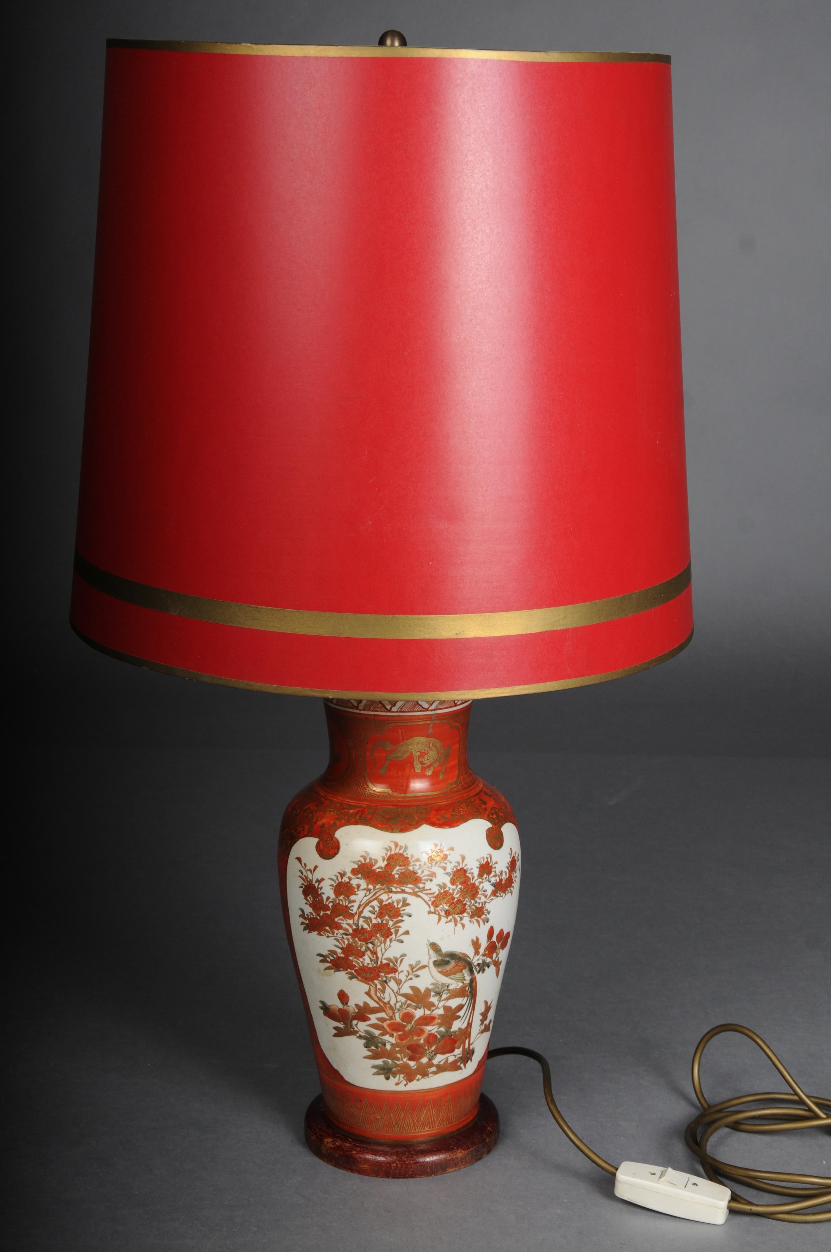 Old Asian porcelain table lamp, red with shade, electrified

Beautiful old Asian table lamp, red background with gold ornaments. In the center on a white background, fine floral painting on both sides.
Eltrified with 2 light bulb sockets and a