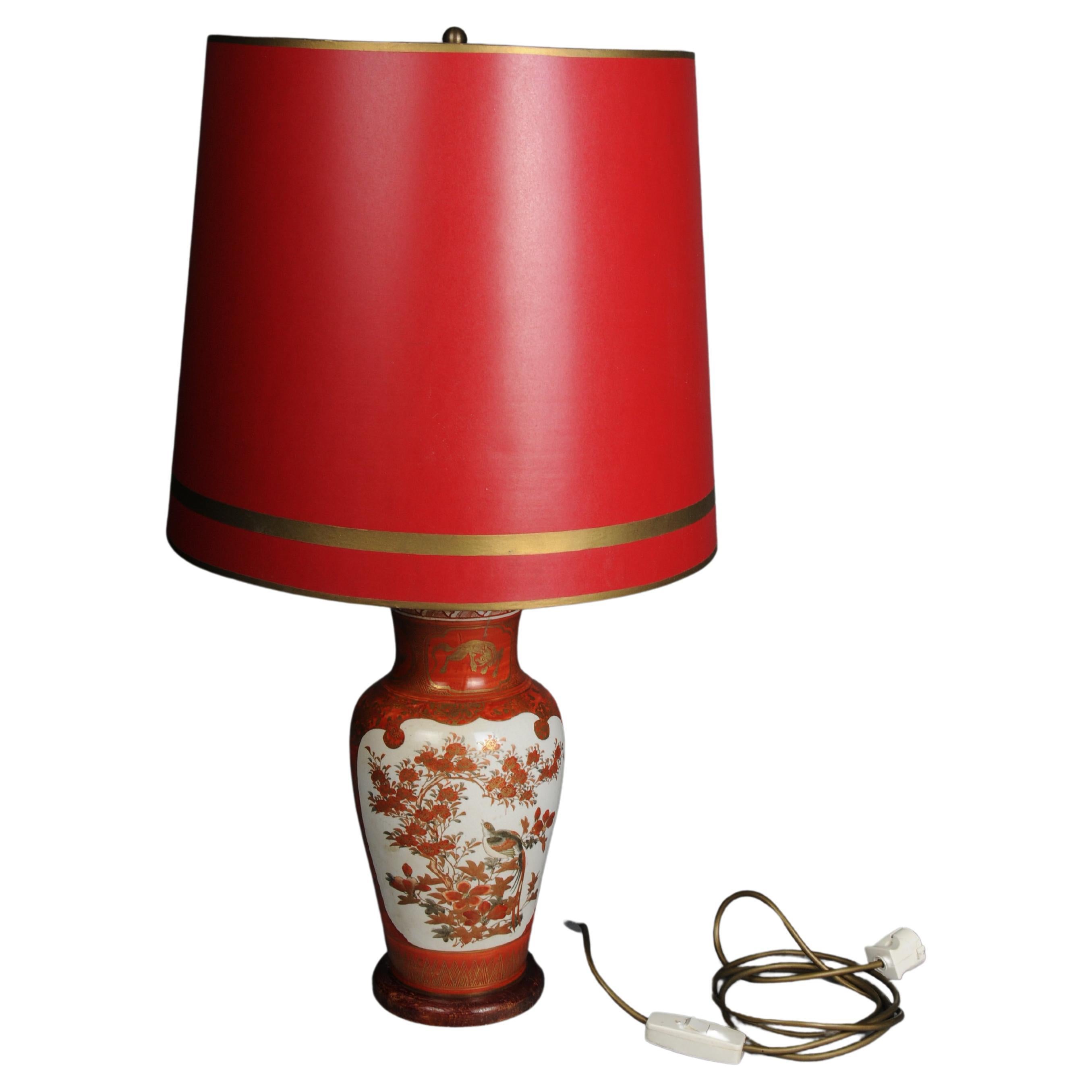 Old Asian porcelain table lamp, red with shade, electrified For Sale