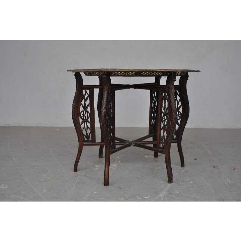 Old Asian tea table with openwork copper top, foldable base. Period late nineteenth. Dimension height 61 cm for a tray diameter of 80 cm.

Additional information:
Material: Leather & skai
Style: Asian.