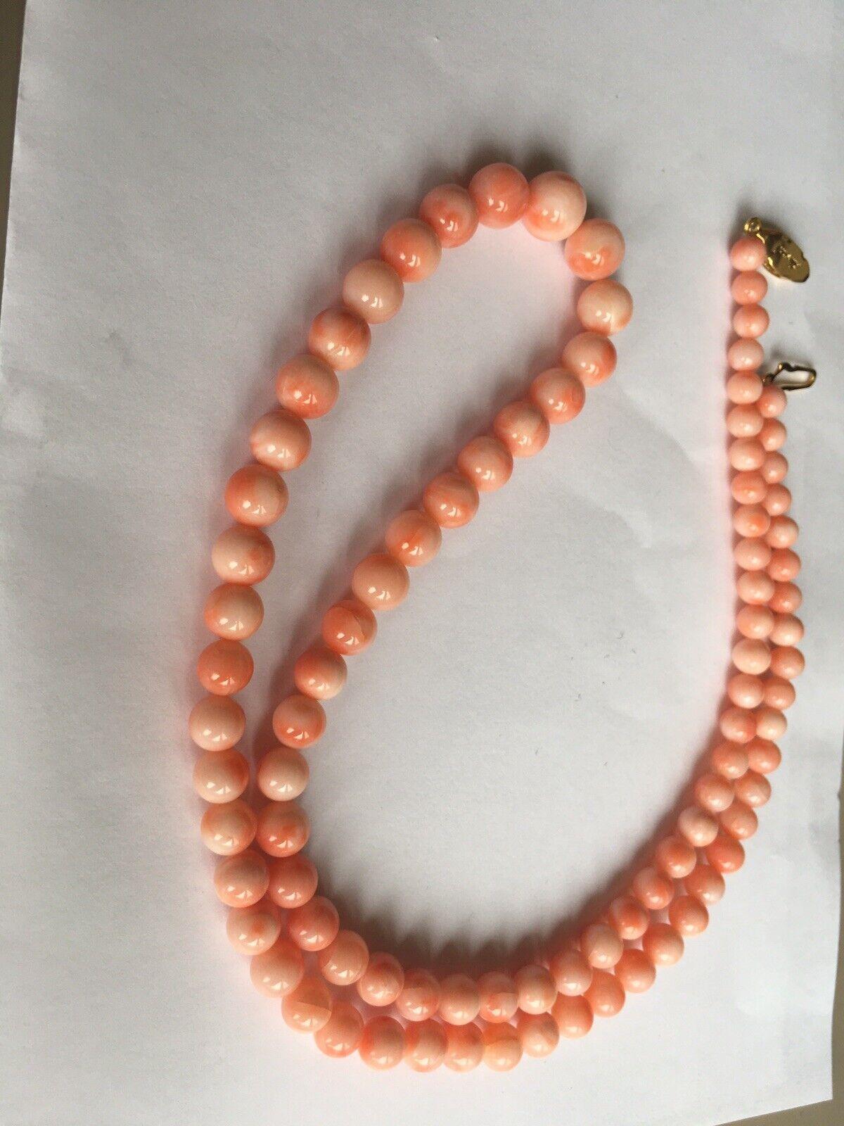 GRADUATED ANGEL SKIN CORAL NECKLACE Very fresh condition old stuck Graduated angel skin coal necklace apppx 25.5 inch long with graduated polished Coral beads ranging in size from appx 9.6 mm- 5.5 mm, gold tone fishhook clasp closure , 43
