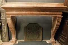 old big fireplace mantle in carved red marble Verona, Italy