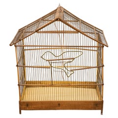 Antique Old Bird Cage with a Bright Little Bird