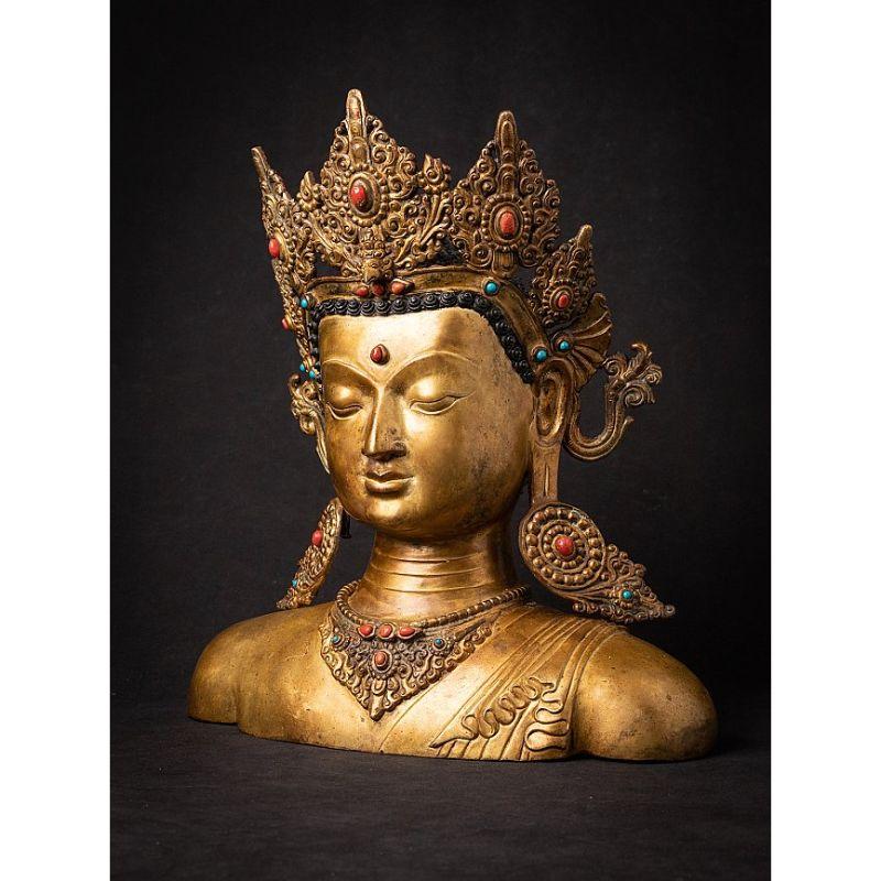Material: bronze
40 cm high 
37 cm wide and 19,5 cm deep
Weight: 8.949 kgs
Fire gilded with 24 krt. gold
Originating from Nepal
Middle 20th century
High quality !
Inlayed with real gem stones.

