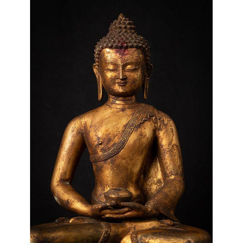 Material: bronze
Measures: 43 cm high 
36 cm wide and 26,5 cm deep
Weight: 10.25 kgs
Fire gilded with 24 krt. gold
Dhyana mudra
Originating from Nepal
Early 20th century
Very high quality !

