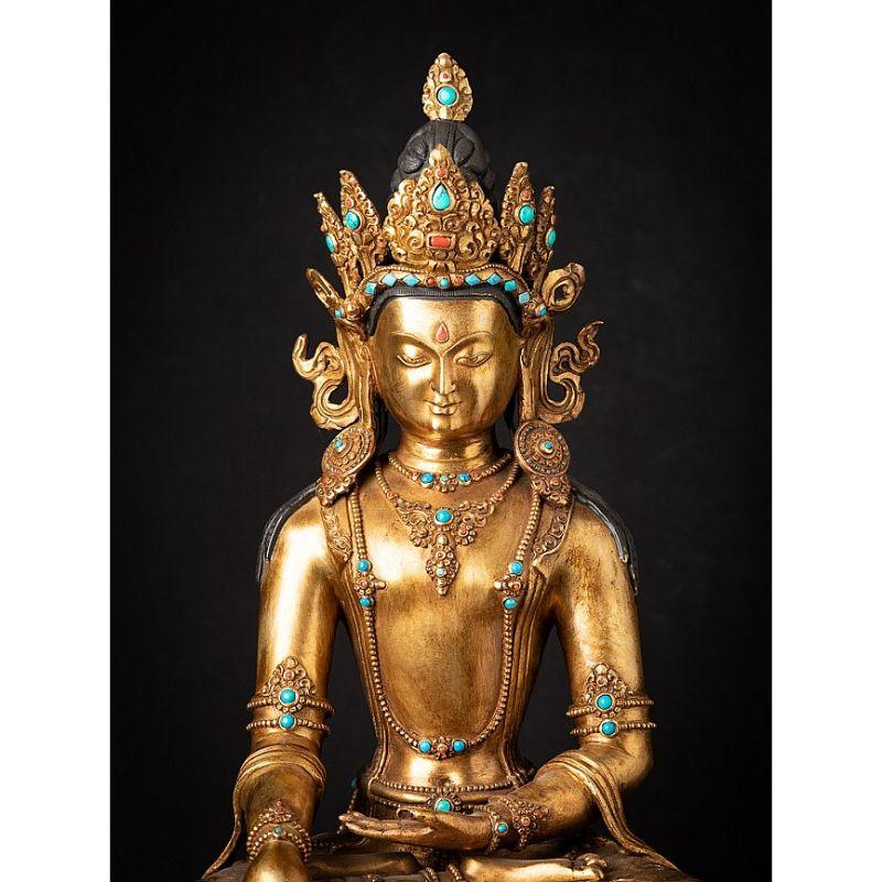 Material: bronze
60,5 cm high 
37,5 cm wide and 30,5 cm deep
Weight: 16.3 kgs
Fire gilded with 24 krt. gold
Bhumisparsha mudra
Originating from Nepal
Middle 20th century
Inlayed with gem stones
Very nice quality !.

