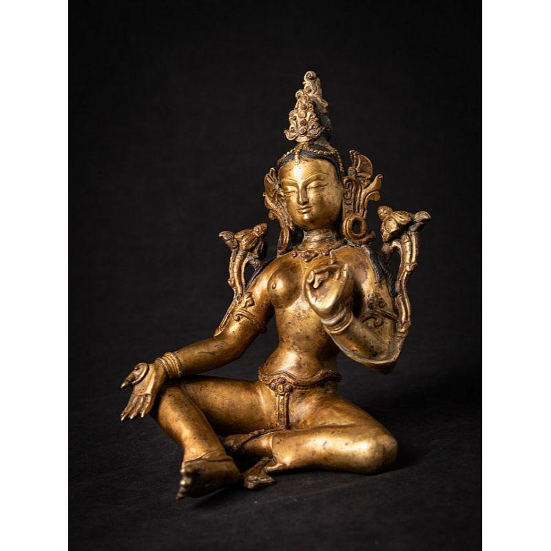 Material: bronze
20 cm high 
14 cm wide and 11,5 cm deep
Weight: 1.279 kgs
Fire gilded with 24 krt. gold
Vitarka mudra
Originating from Nepal
Middle 20th century

