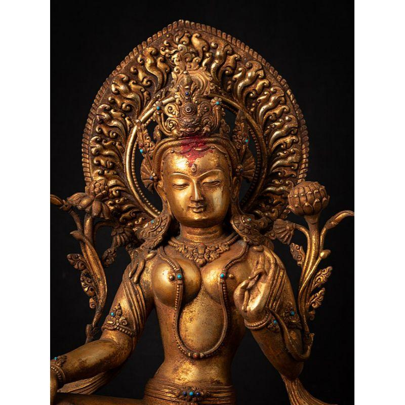 Material: bronze
51 cm high 
32,3 cm wide and 28 cm deep
Weight: 10.450 kgs
Fire gilded with 24 krt. gold
Originating from Nepal
Middle 20th century
Inlayed with gem stones

