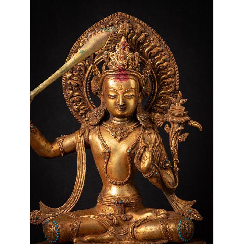 Material: bronze
50,5 cm high 
30,5 cm wide and 24,5 cm deep
Weight: 8.95 kgs
Fire gilded with 24 krt. gold
Originating from Nepal
Middle 20th century
Inlayed with gem stones
High quality !

