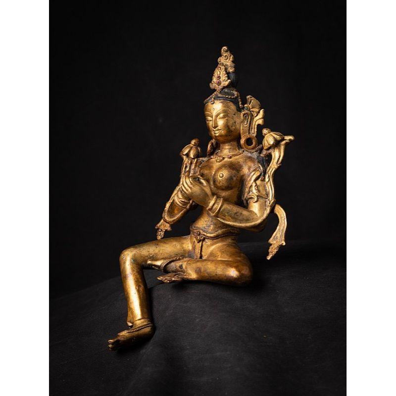 Material: bronze
26,7 cm high 
14,7 cm wide and 10,8 cm deep
Weight: 1.278 kgs
Fire gilded with 24 krt. gold
Dharmachakra mudra
Originating from Nepal
Middle 20th century
Made in high quality !.

