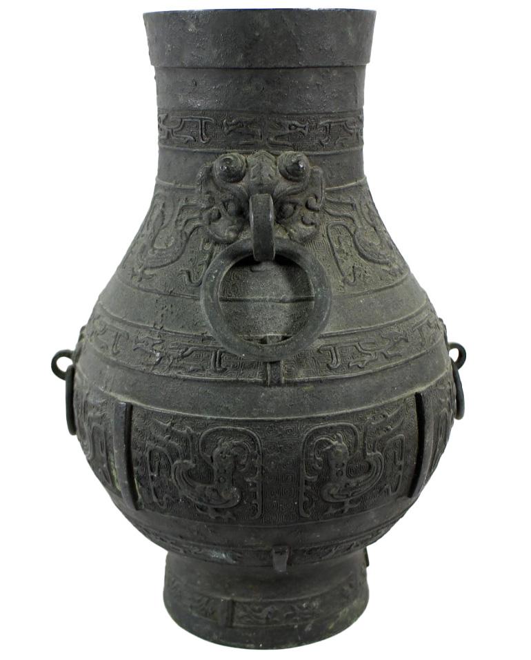 Unearth a piece of history with this captivating old bronze vessel, a treasure that speaks volumes of its rich past. Discovered and now presented for your consideration, this artifact is a splendid example of Asian craftsmanship, adorned with