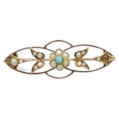Old brooch with turquoise and pearls
