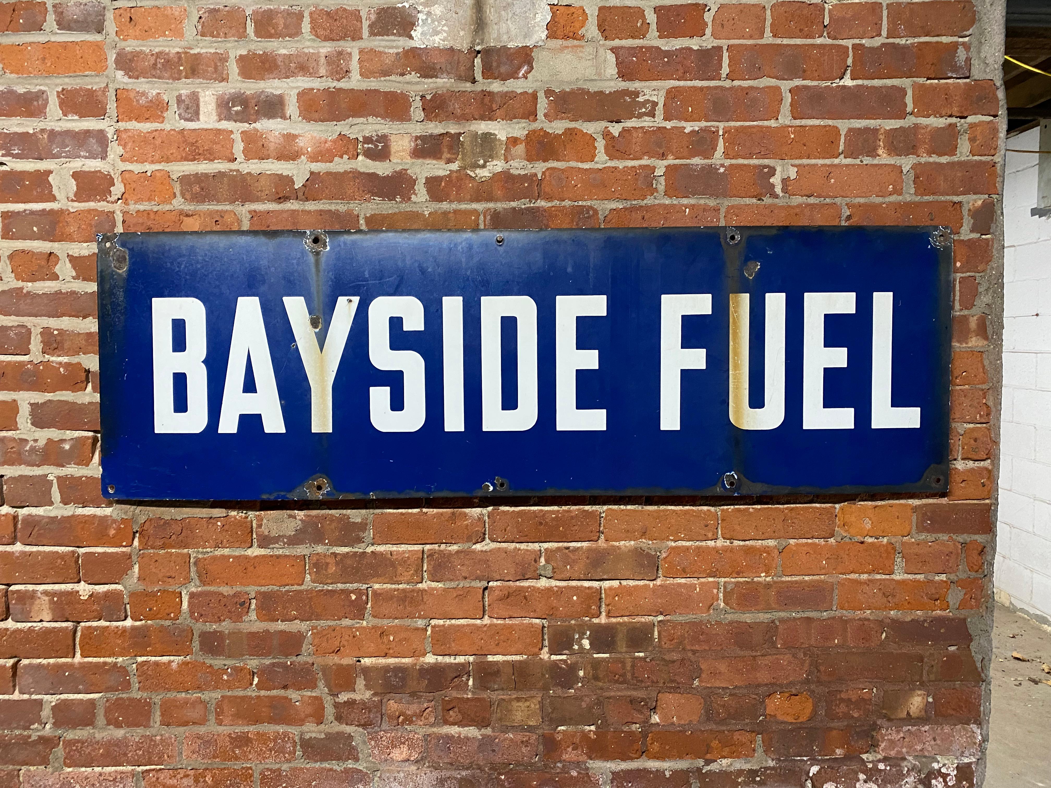 A nice dose of Old Brooklyn. A large cobalt enamel on steel Bayside Fuel advertising sign. Formerly Astral Oil Works, the becoming Bayside Fuel circa 1937. The old terminal on Kent Avenue borders on Greenpoint and Williamsburg. The rectangular sign