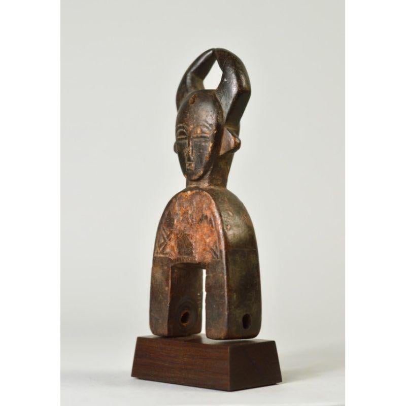 Old Buffalo head Djimini pulley in wood.

This lovely old pulley is from the estate of Catherine Cline (née Crone, 1935-2020), who began collecting African art in the early 1960s in New York City through a friend, Thomas McNemar, then freshly back