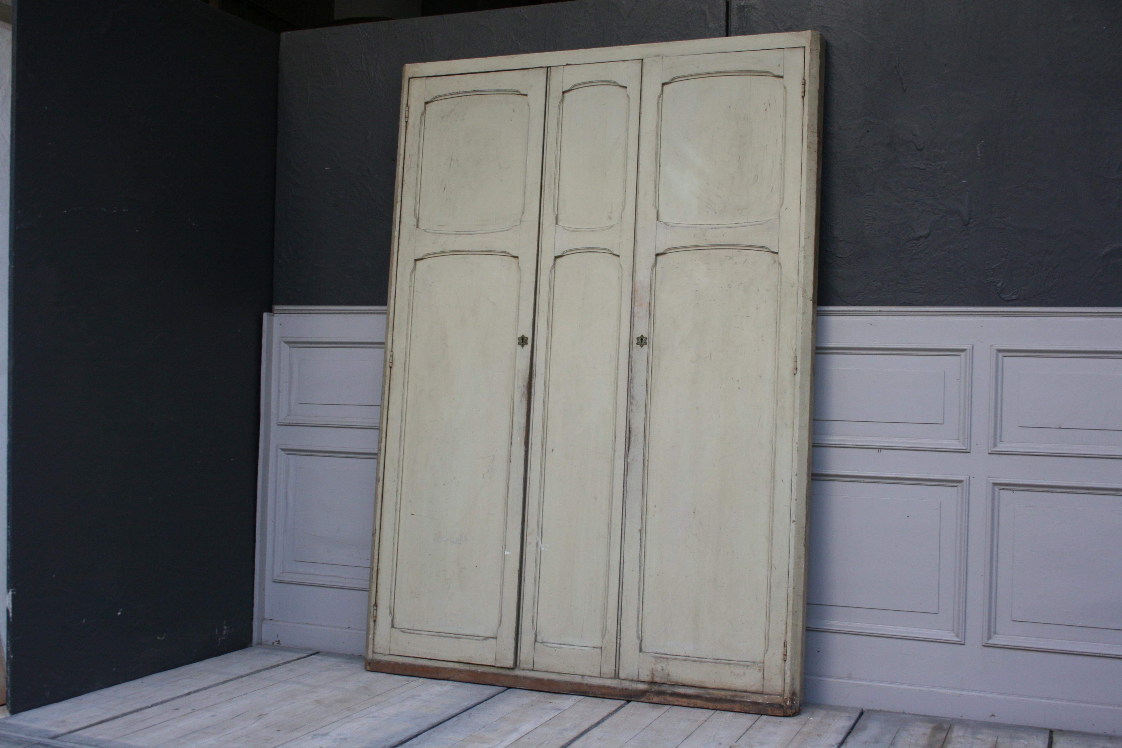 Original old built-in wardrobe front with doors from Germany, circa 1920. Original color patina and really special fittings in star shape. 

Dimensions: 210 cm high, 150 cm wide, 10 cm deep.