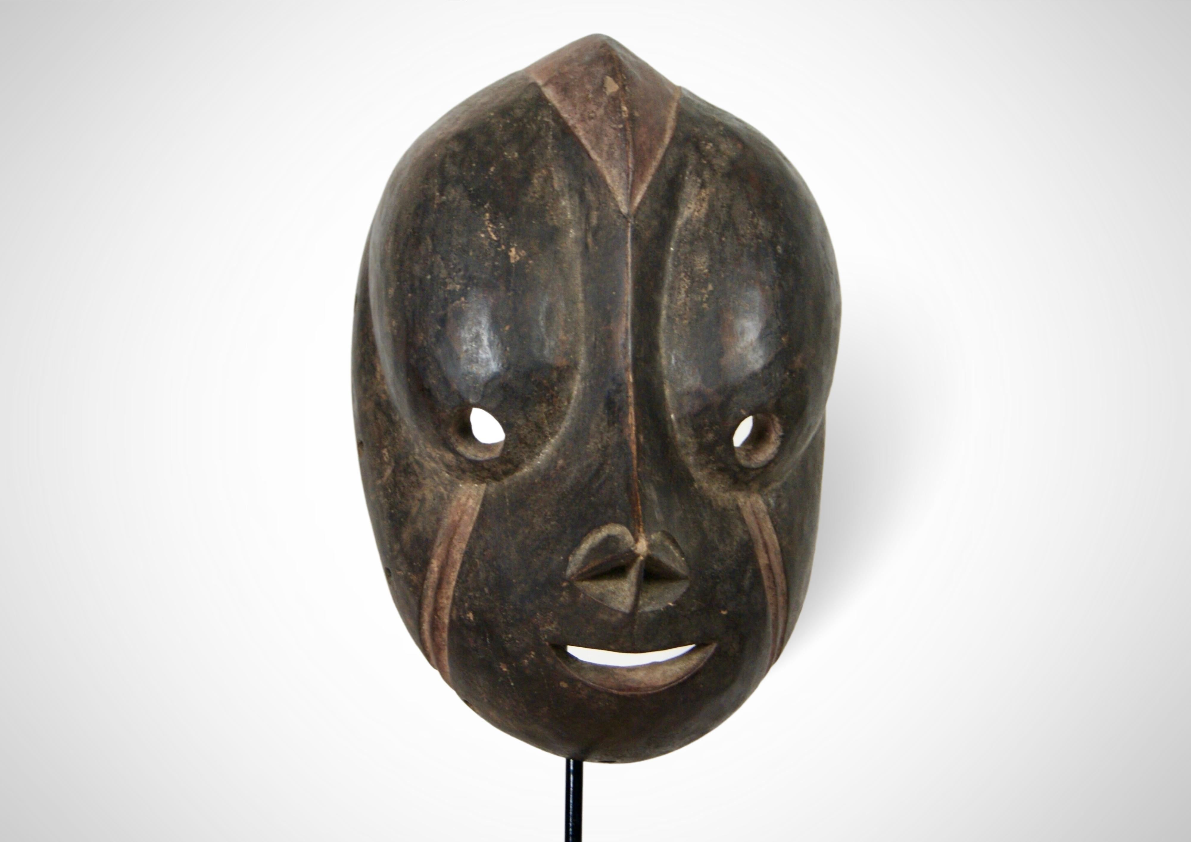 On offer is a rare large sized 'Singe' Monkey mask from the Bulu people of south central Cameroon. The Bulu are a sub-group of the Cameroon Fang, having originated from Gabon.
 
This is a typical boldly carved Bulu mask, very smooth and beautifully