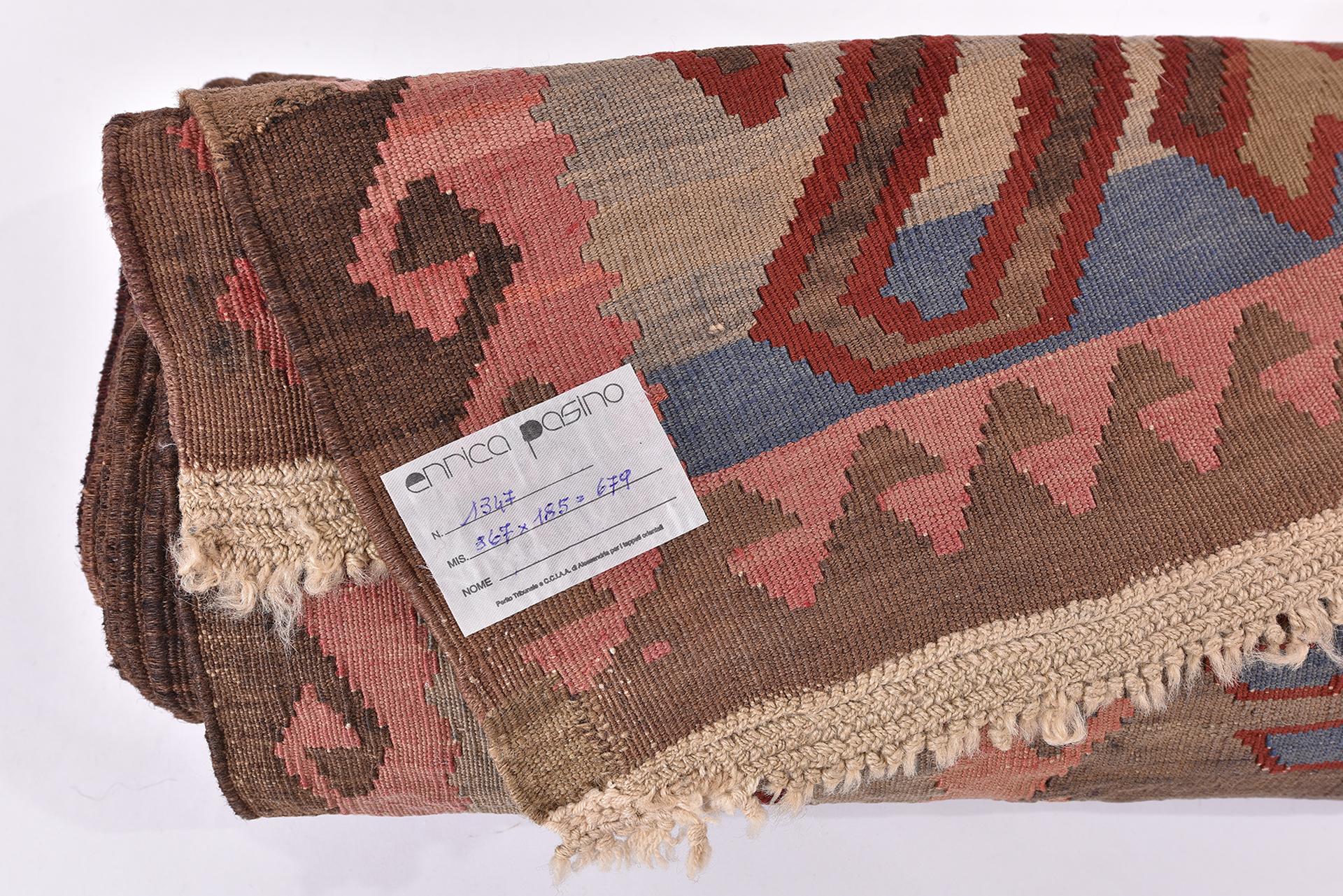 nr. 1347 - A Caucasian kilim with a particular appearance, given by the design with a strong personality and the intense shade of the background color.  I also accepted the small restoration in the corner, out of respect to its age.  upon request I