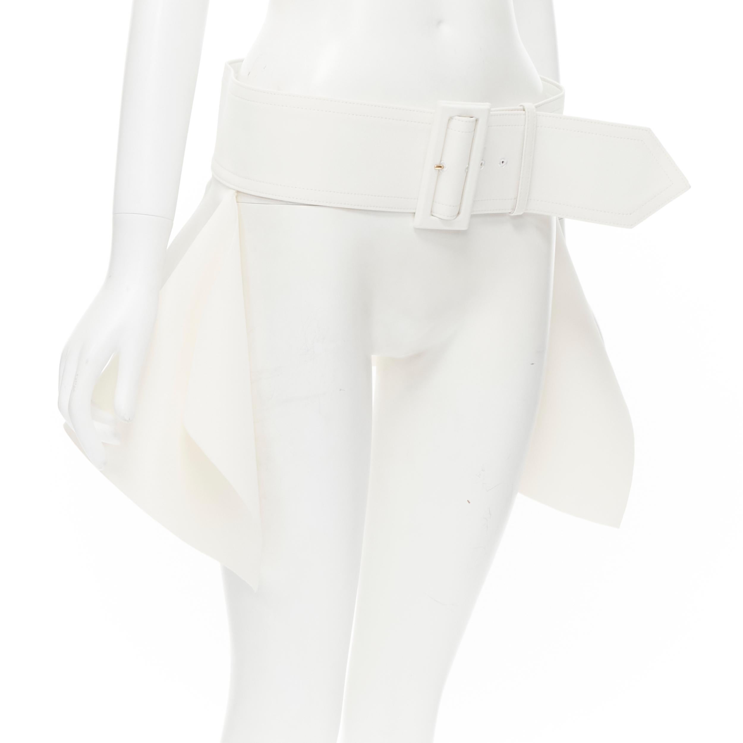 OLD CELINE 2012 Phoebe Philo white leather lined large buckle peplum belt S 
Reference: TGAS/B01663 
Brand: Celine 
Designer: Phoebe Philo 
Collection: Spring Summer 2012 Runway 
Material: Crepe 
Color: White 
Pattern: Solid 
Closure: Buckle 
Extra