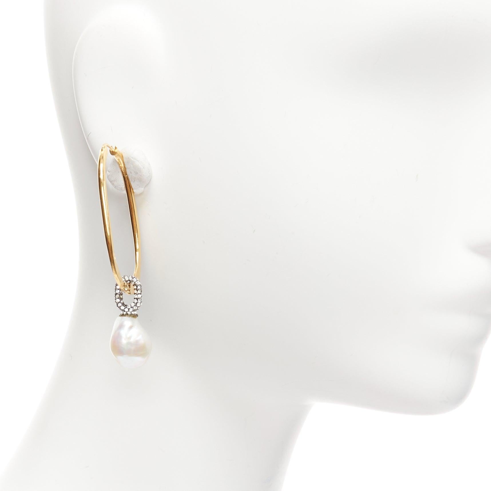 OLD CELINE Baroque Pearl crystal pave gold dangling oval hoop earrings pair
Reference: TGAS/D01109
Brand: Celine
Designer: Phoebe Philo
Material: Metal, Faux Pearl
Color: Gold, Pearl
Pattern: Crystals
Closure: Loop Through
Lining: Gold Metal
Made