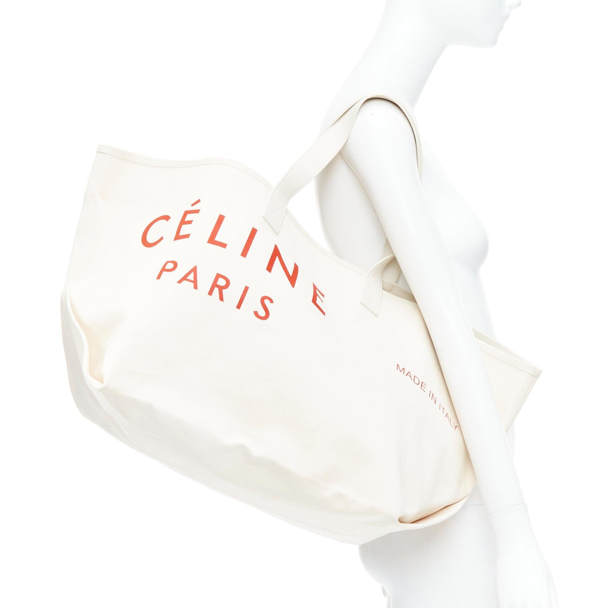 OLD CELINE Philo Made In red logo cream canvas leather trim tote bag
Reference: LNKO/A02470
Brand: Celine
Designer: Phoebe Philo
Model: Made In
Material: Canvas, Leather
Color: Beige, Red
Pattern: Solid
Lining: Cream Canvas
Extra Details: Neutrals