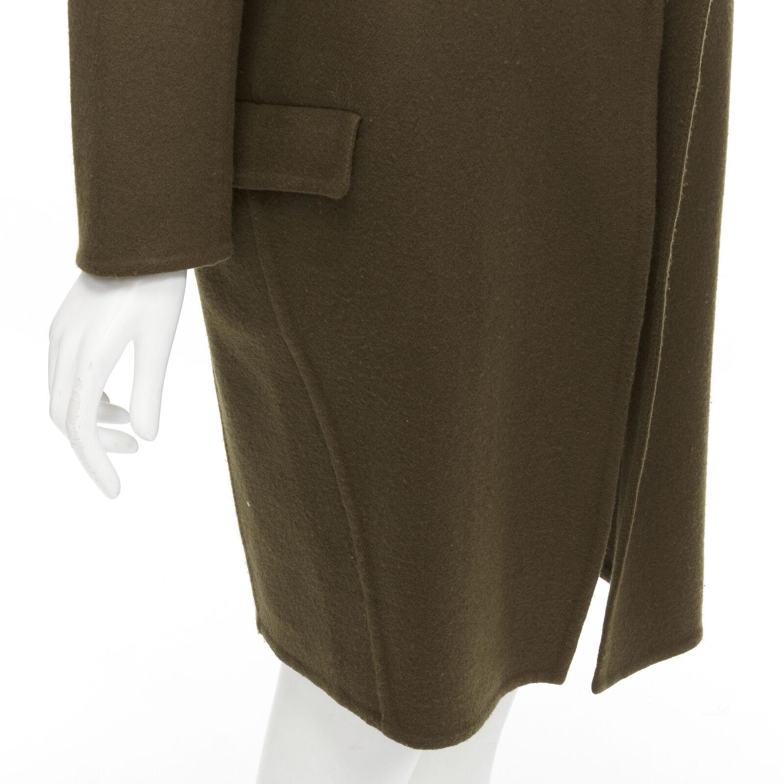 OLD CELINE Phoebe Philo 100% cashmere dark green unlined oversized coat FR34 XS
Reference: TGAS/C01522
Brand: Celine
Designer: Phoebe Philo
Material: 100% Cashmere
Color: Green
Pattern: Solid
Lining: Partially Lined
Extra Details: Military green