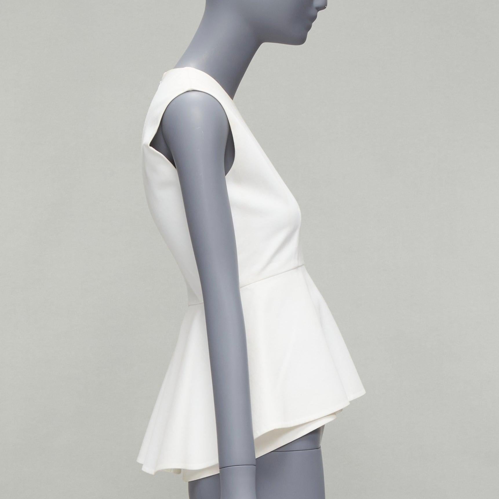 OLD CELINE Phoebe Philo 2012 white cotton peplum sleeveless fitted top FR34 XS
Reference: SNKO/A00223
Brand: Celine
Designer: Phoebe Philo
Material: Cotton
Color: White
Pattern: Solid
Closure: Zip
Lining: White Cotton
Extra Details: Back zip detail.