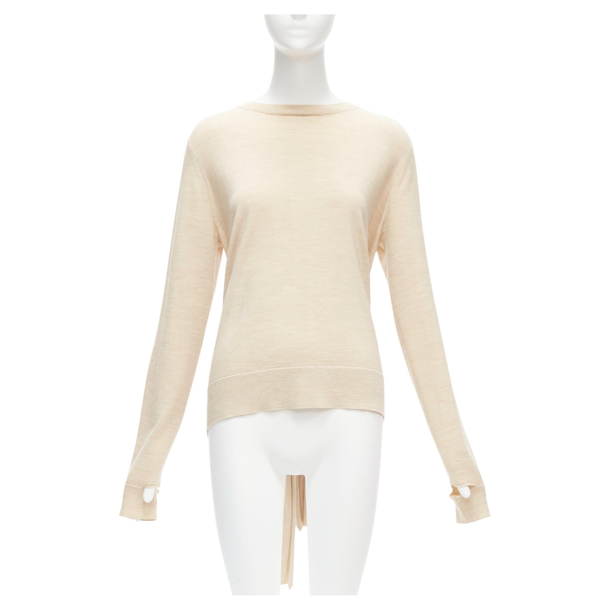 OLD CELINE Phoebe Philo beige wool silk knot tie back cut out sleeves sweater M
Reference: TGAS/D00352
Brand: Celine
Designer: Phoebe Philo
Material: Wool, Silk
Color: Beige
Pattern: Solid
Closure: Pullover
Extra Details: Cuff cut out details. Back