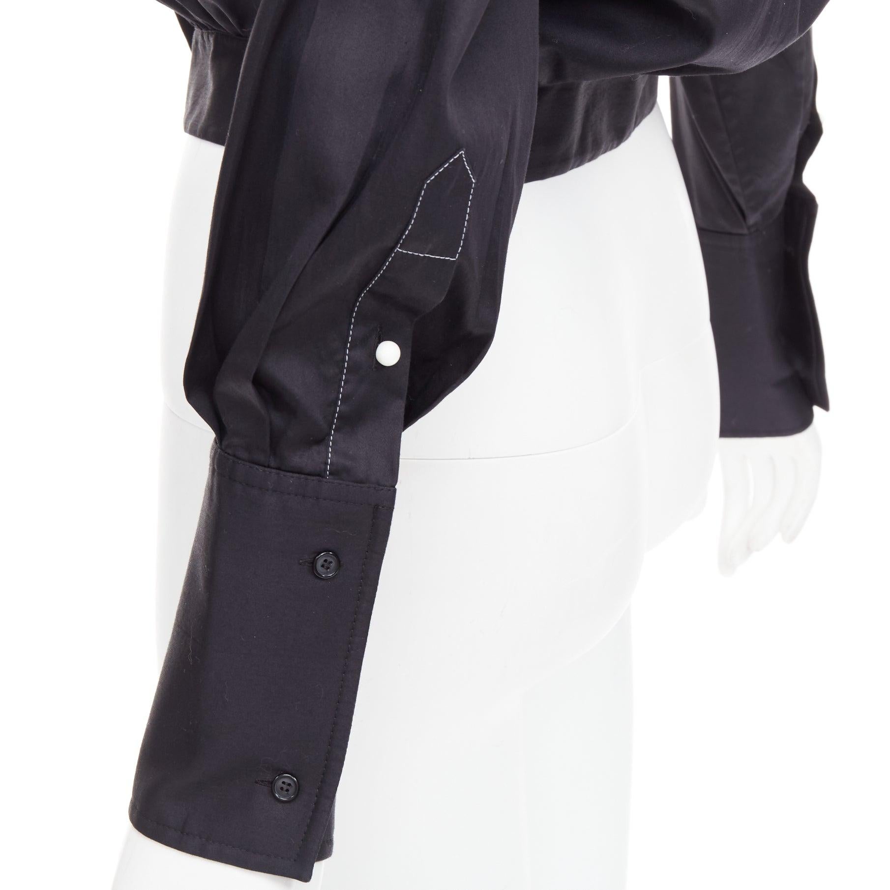 OLD CELINE Phoebe Philo black cotton puff cropped bomber shirt FR34 XS
Reference: YIKK/A00222
Brand: Celine
Designer: Phoebe Philo
Material: Cotton
Color: Black, White
Pattern: Solid
Closure: Button
Extra Details: White sphere buttons.
Made in: