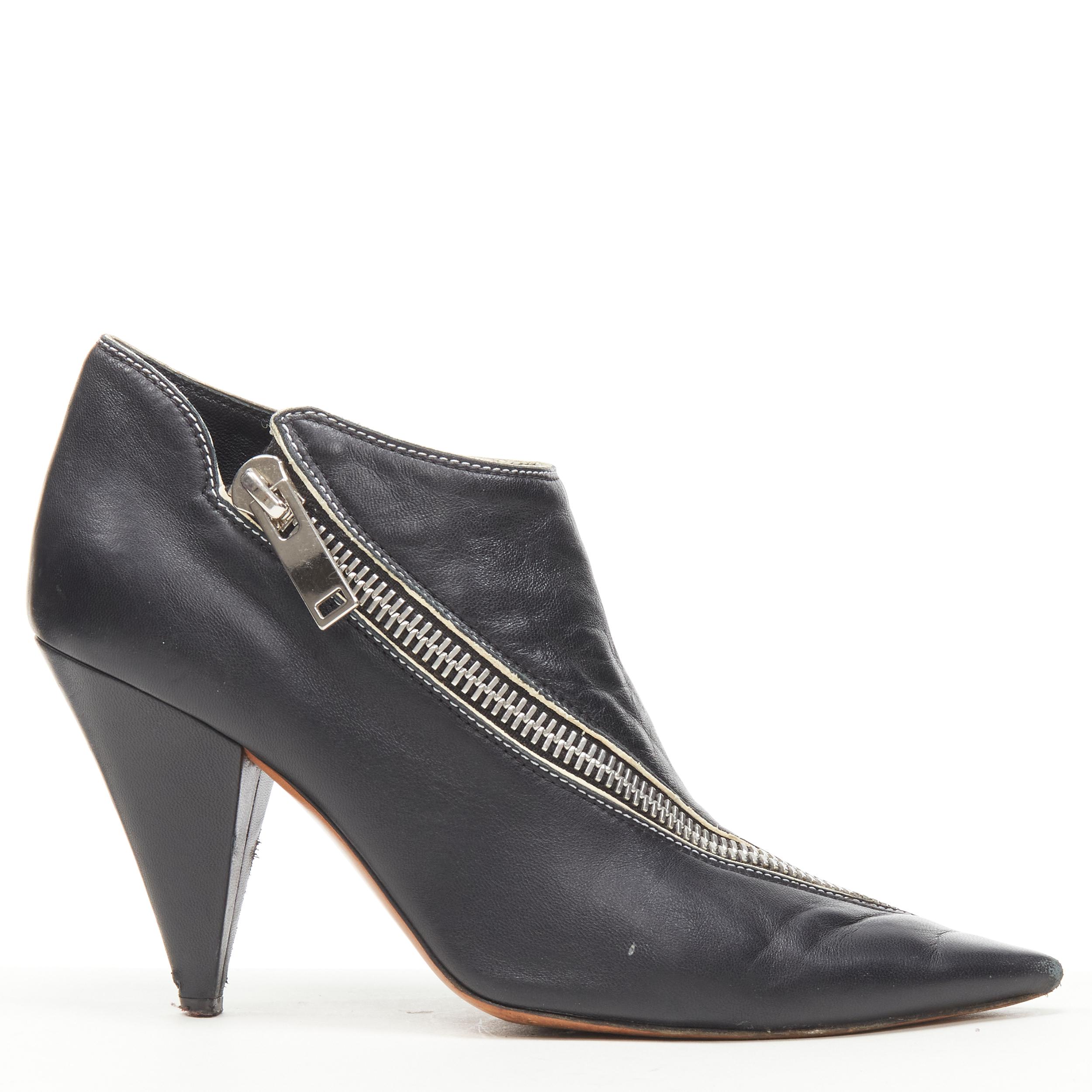 OLD CELINE Phoebe Philo black leather twist silver zip cone heel bootie EU36.5 
Reference: JACG/A00064 
Brand: Celine 
Designer: Phoebe Philo 
Material: Leather 
Color: Black 
Pattern: Solid 
Closure: Zip 
Made in: Italy 

CONDITION: 
Condition:
