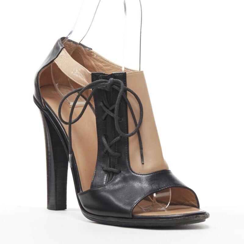 OLD CELINE Phoebe Philo black nude leather lace open side peep toe bootie EU40.5
Reference: TGAS/A05370
Brand: Celine
Designer: Phoebe Philo
Model: Open bootie
Material: Leather
Color: Black, Nude
Pattern: Solid
Closure: Lace Up
Extra Details: Lace