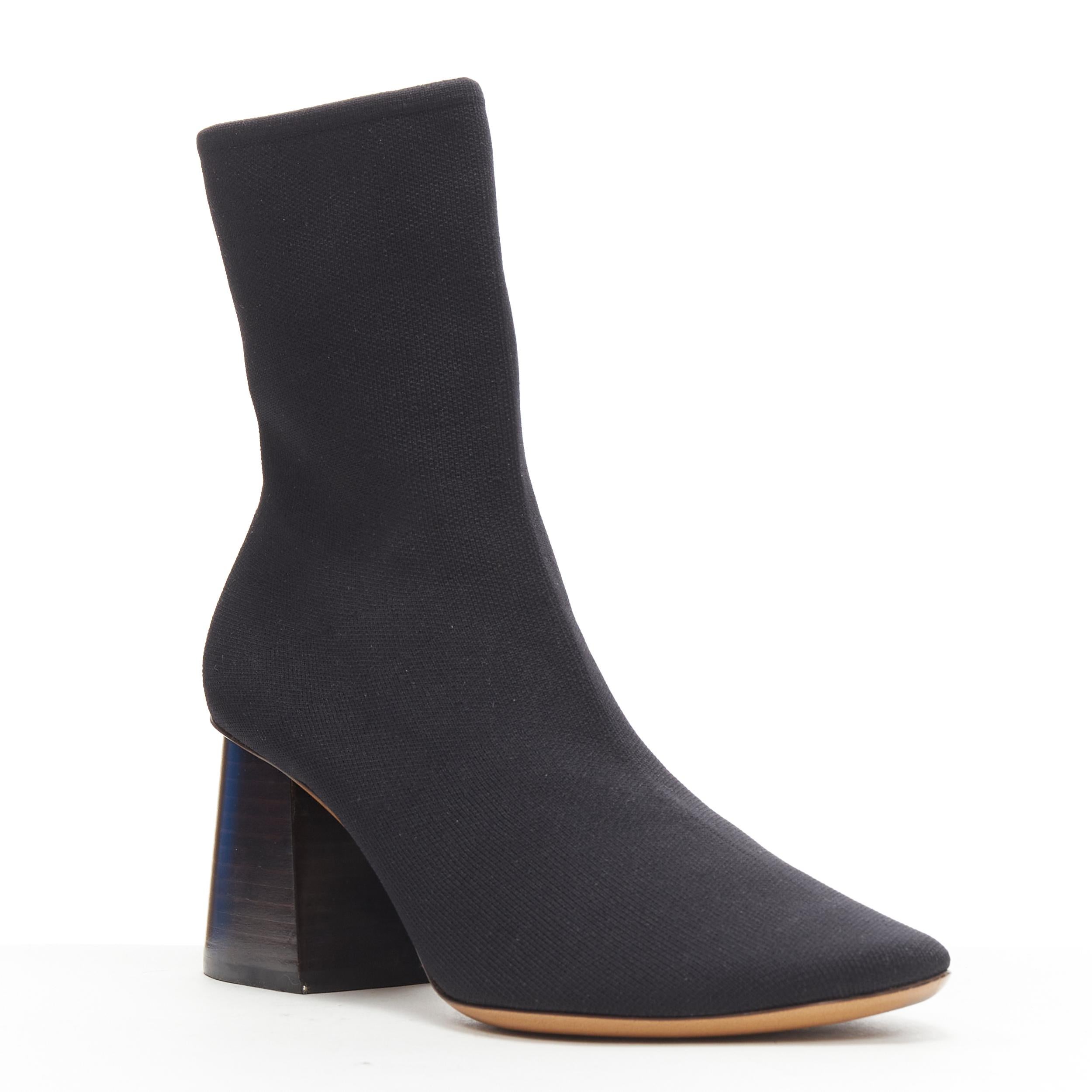 OLD CELINE PHOEBE PHILO black sock knit round toe wooden block heel bootie EU37 Reference: TGAS/B01060 
Brand: Celine 
Designer: Phoebe Philo 
Material: Fabric 
Color: Black 
Pattern: Solid 
Extra Detail: Sock knit upper. Round toe. Stretch fit.