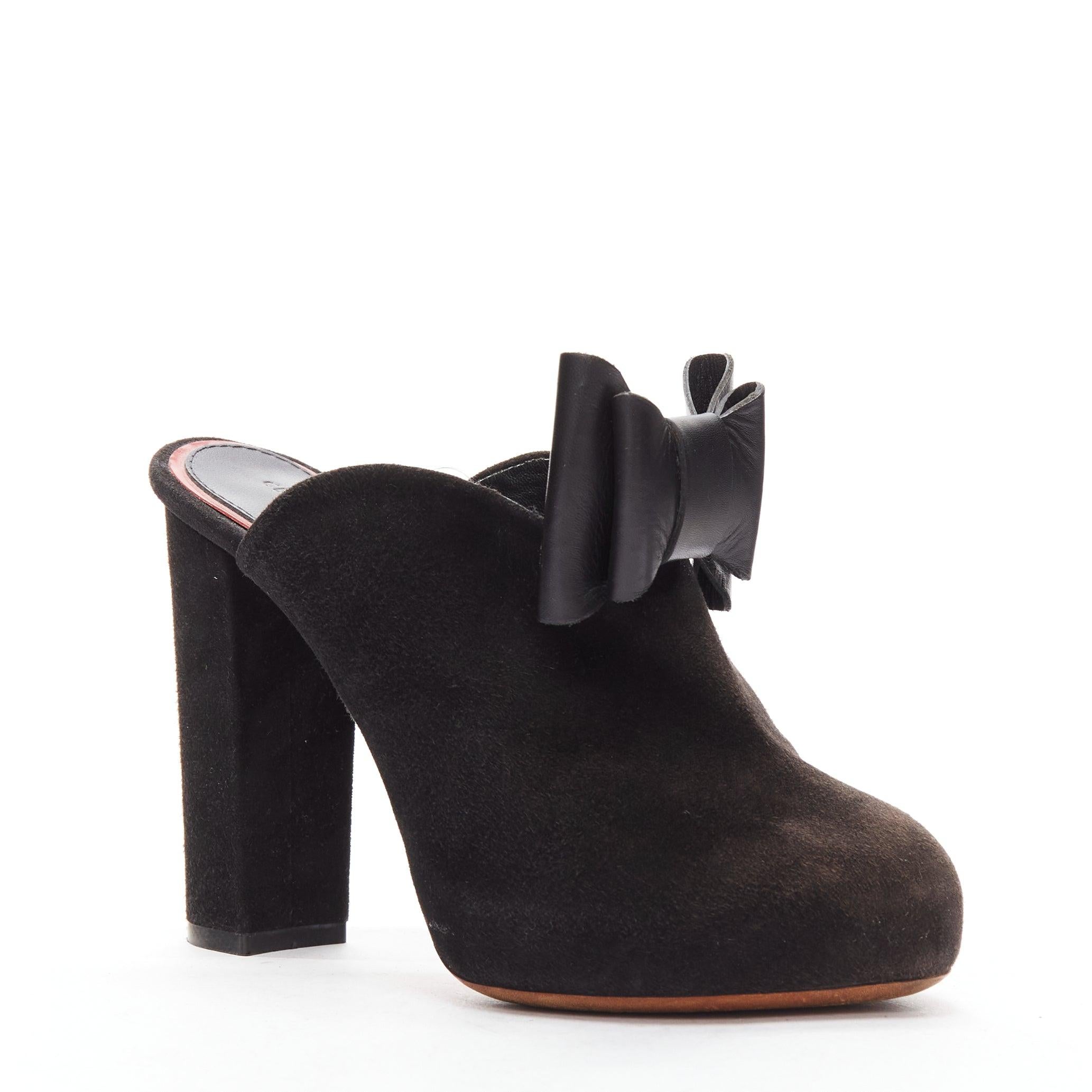 OLD CELINE Phoebe Philo black suede bow high heel mules EU36.5
Reference: TGAS/D00548
Brand: Celine
Designer: Phoebe Philo
Collection: Runway
Material: Suede
Color: Black
Pattern: Solid
Closure: Slip On
Lining: Black Leather
Made in: