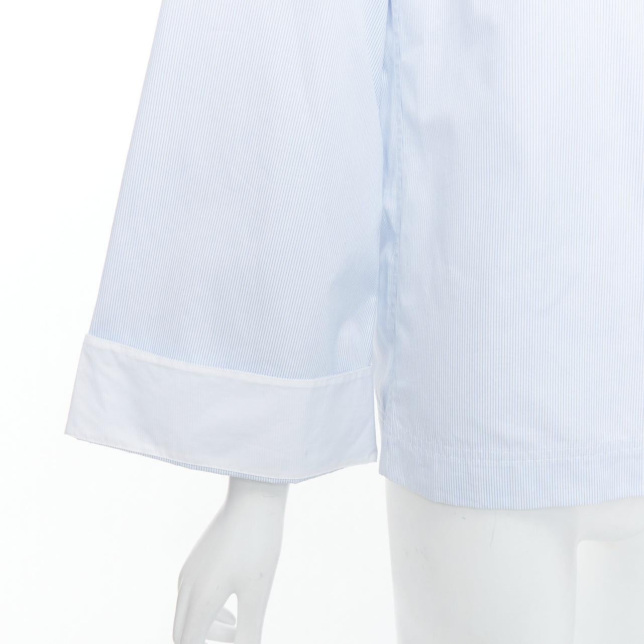 OLD CELINE Phoebe Philo blue pinstripe flare cuffed shirt top FR34 XS
Reference: YIKK/A00135
Brand: Celine
Designer: Phoebe Philo
Collection: Circa 2016
Material: Cotton
Color: White, Blue
Pattern: Pinstriped
Closure: Button
Extra Details: Circa