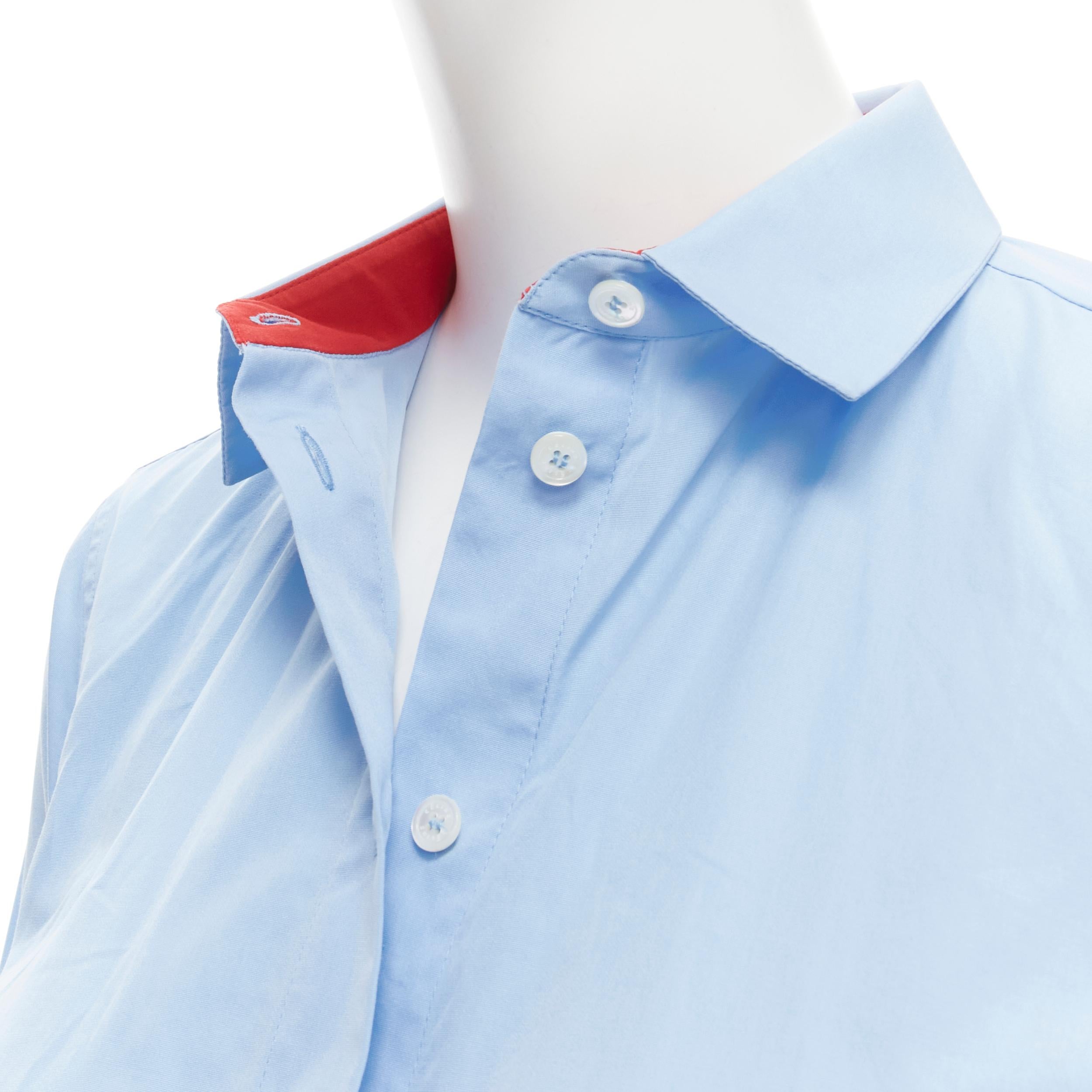 OLD CELINE Phoebe Philo blue red lined collar slim fit shirt FR36 XS 
Reference: MELK/A00131 
Brand: Celine 
Designer: Phoebe Philo 
Material: Cotton 
Color: Blue 
Pattern: Solid 
Closure: Button 
Extra Detail: Red trimming at collar lining. 
Made