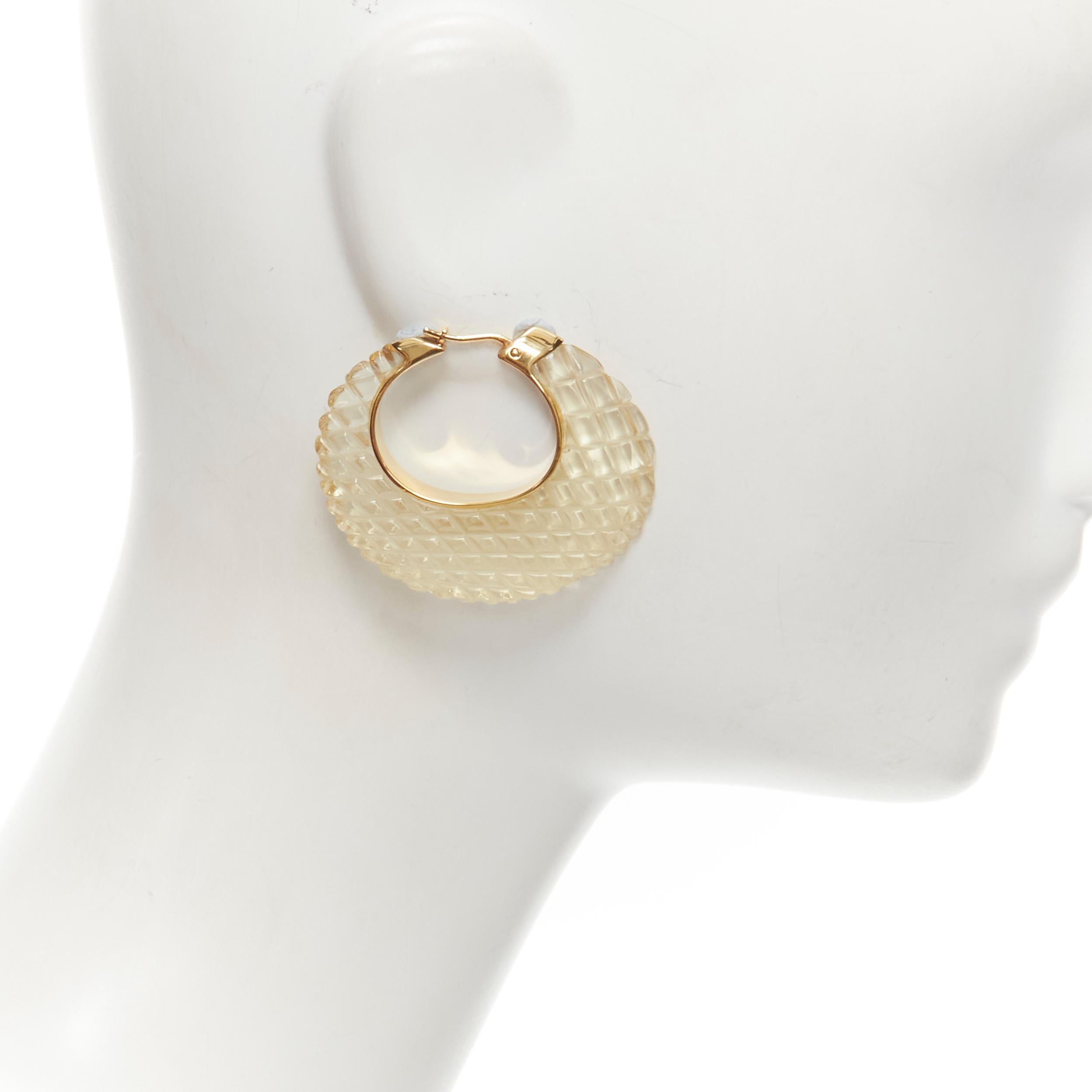 OLD CELINE Phoebe Philo clear lucite quilted gold tone hoop earrings 
Reference: LNKO/A01916 
Brand: Celine 
Designer: Phoebe Philo 
Material: Resin 
Color: Clear 
Pattern: Solid 
Closure: Pin 
Extra Detail: Clear resin with diamond quilting.