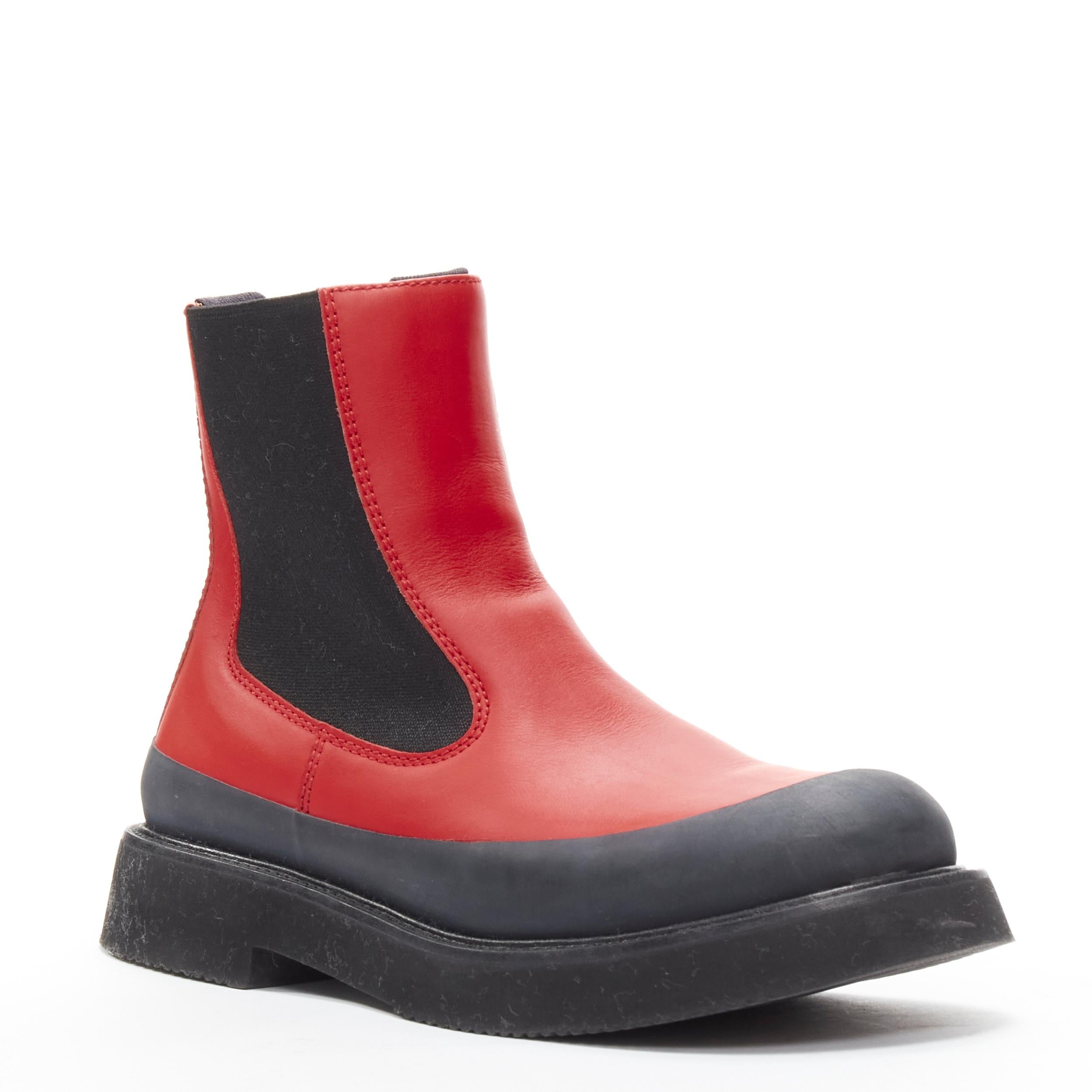 OLD CELINE Phoebe Philo Country red leather black rubber chunky ankle boot EU37
Brand: Celine
Designer: Phoebe Philo
Material: Calfskin Leather
Color: Red
Pattern: Solid
Extra Detail: Red leather upper. Rubberised trim around outsole. XL chunky