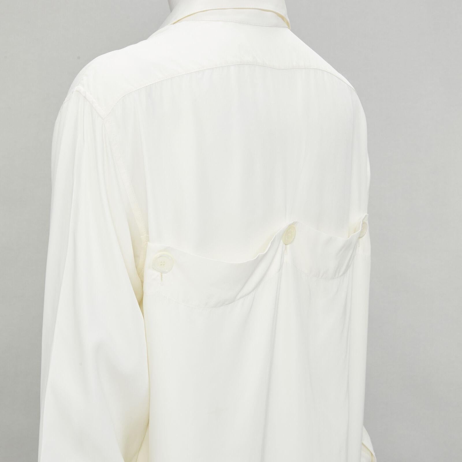 OLD CELINE Phoebe Philo cream viscose button detail back high low shirt FR36 S
Reference: JACG/A00076
Brand: Celine
Designer: Phoebe Philo
Material: Viscose
Color: Cream
Pattern: Solid
Closure: Button
Extra Details: Wide double button cuff. Button