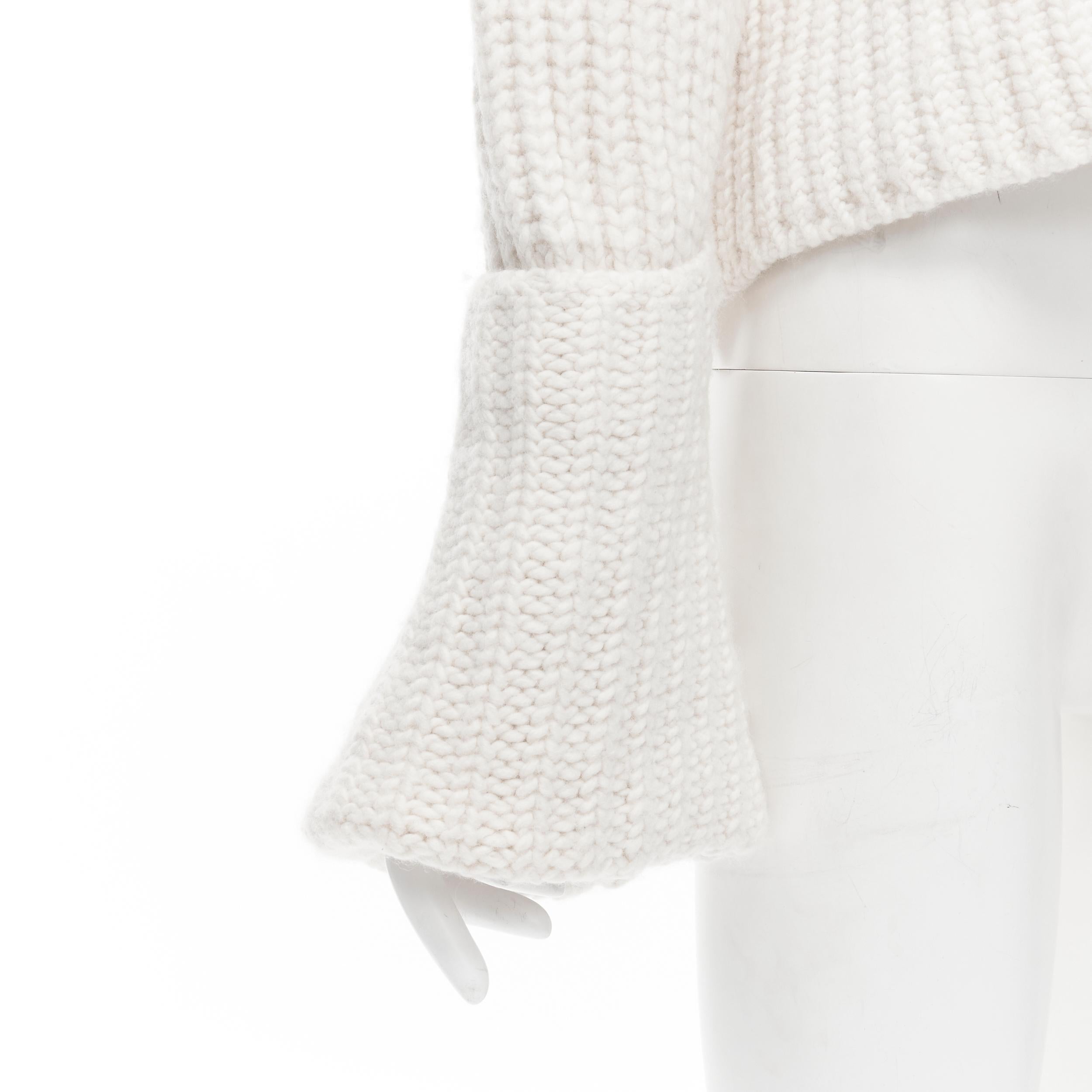 OLD CELINE Phoebe Philo heavy knit wool cuffed sleeve cropped sweater XS 
Reference: TGAS/B01874 
Brand: Celine 
Designer: Phoebe Philo 
Material: Wool 
Color: White 
Pattern: Solid 
Extra Detail: Heavy chunky knit. Bell shaped cuffed skeeves.