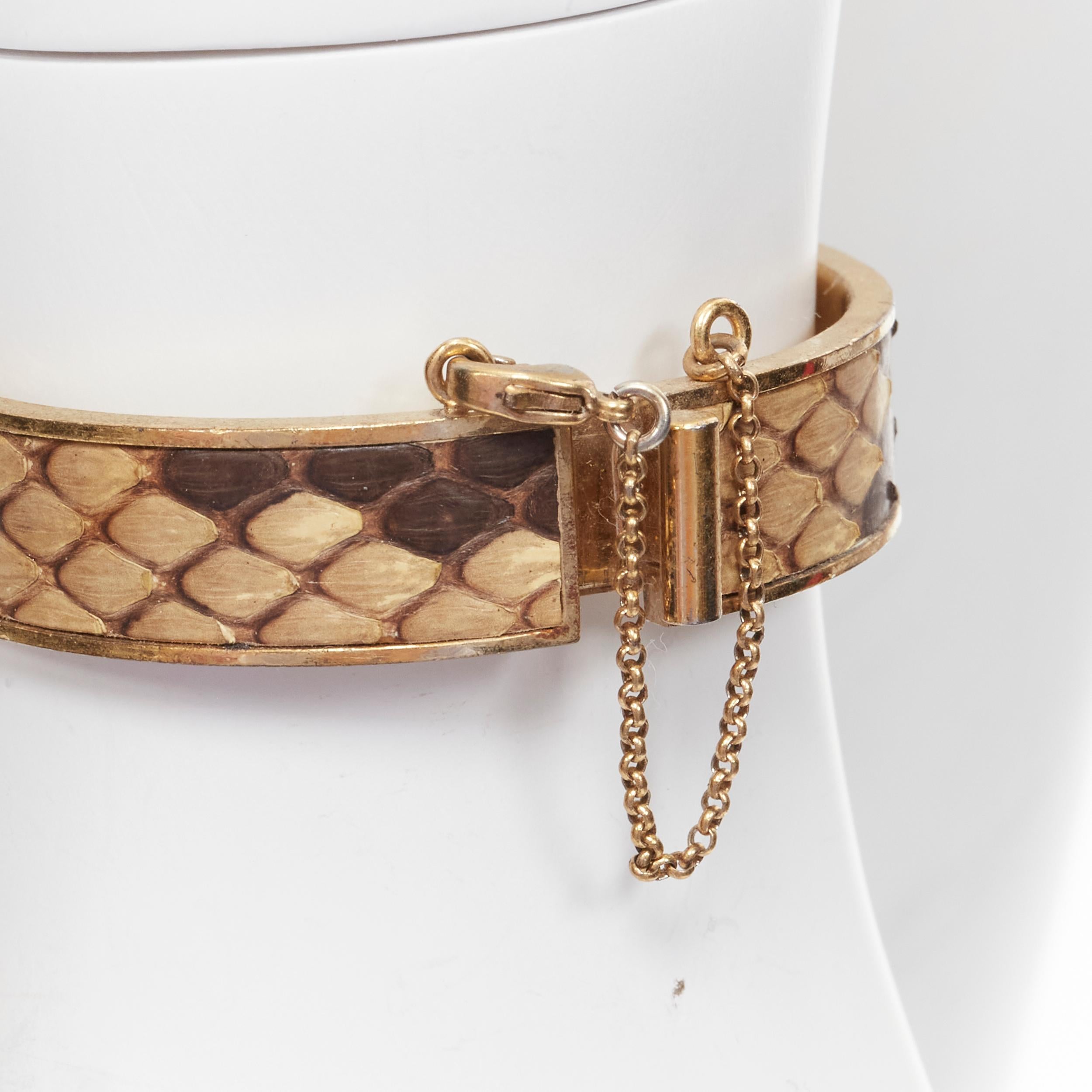 OLD CELINE Phoebe Philo Manchette natural scaled leather gold metal cuff bangle 
Reference: TACW/A00019 
Brand: Celine 
Designer: Phoebe Philo 
Material: Metal 
Color: Gold 
Pattern: Animal Print 
Closure: Clasp 
Extra Detail: Dangling chain with