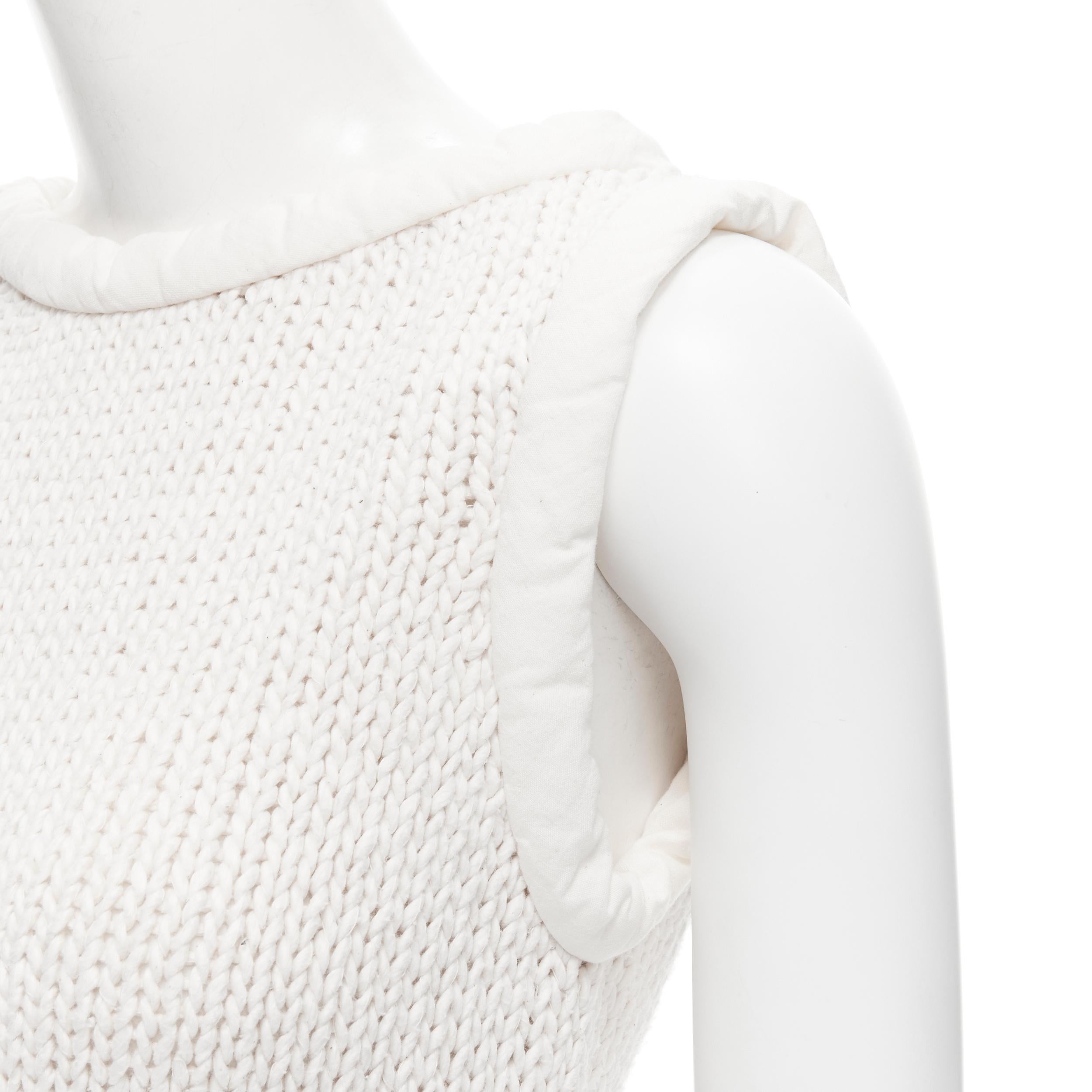 OLD CELINE Phoebe Philo white hand knit padded trim tunic vest XS 
Reference: TGAS/B01873 
Brand: Celine 
Designer: Phoebe Philo 
Material: Cotton 
Color: White 
Pattern: Solid 
Extra Detail: Padded tubular trimming at neckline and sleeve. Slit side