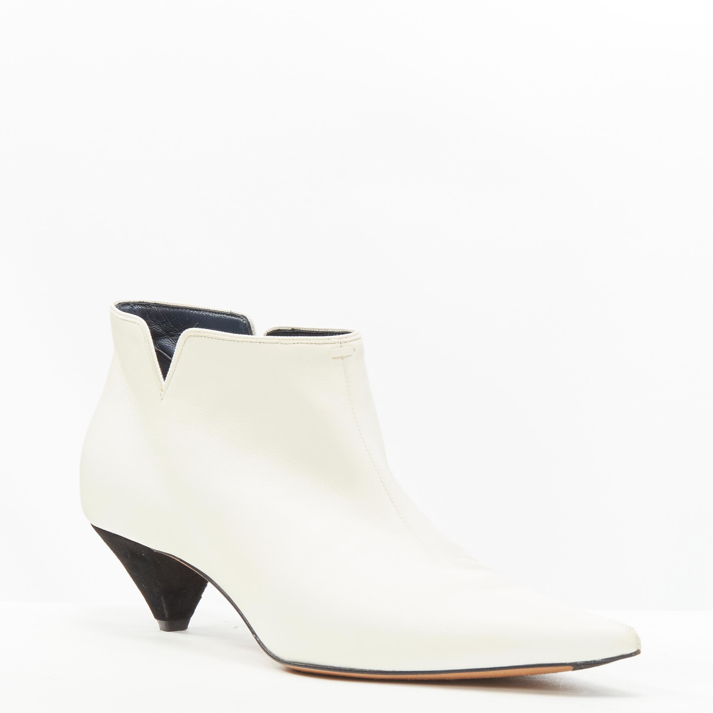 OLD CELINE Phoebe Philo white soft leather suede cone heel ankle bootie EU38 
Reference: LNKO/A01935 
Brand: Celine 
Designer: Phoebe Philo 
Material: Leather 
Color: White 
Pattern: Solid 
Extra Detail: White soft leather upper. Cut out dent along