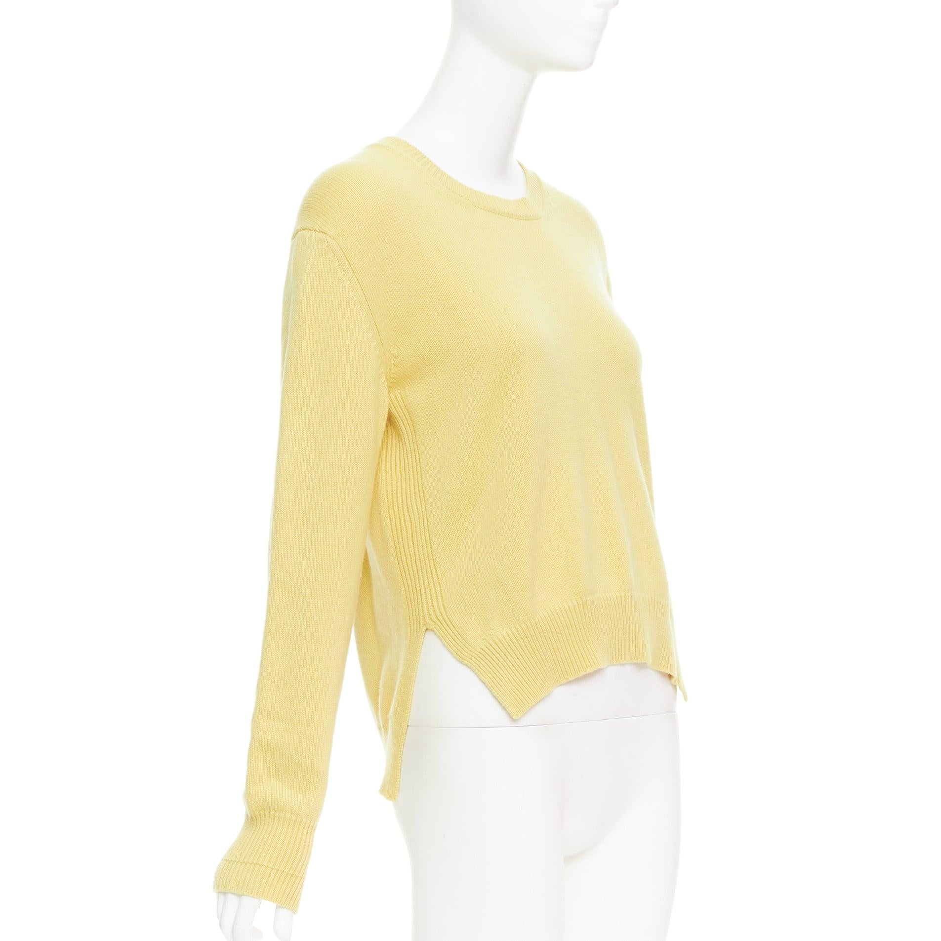 OLD CELINE Phoebe Philo yellow cashmere anagram logo sweater S
Reference: GEGG/A00044
Brand: Celine
Designer: Phoebe Philo
Material: Cashmere
Color: Yellow
Pattern: Solid
Closure: Pullover
Extra Details: Hi low hem.
Made in: