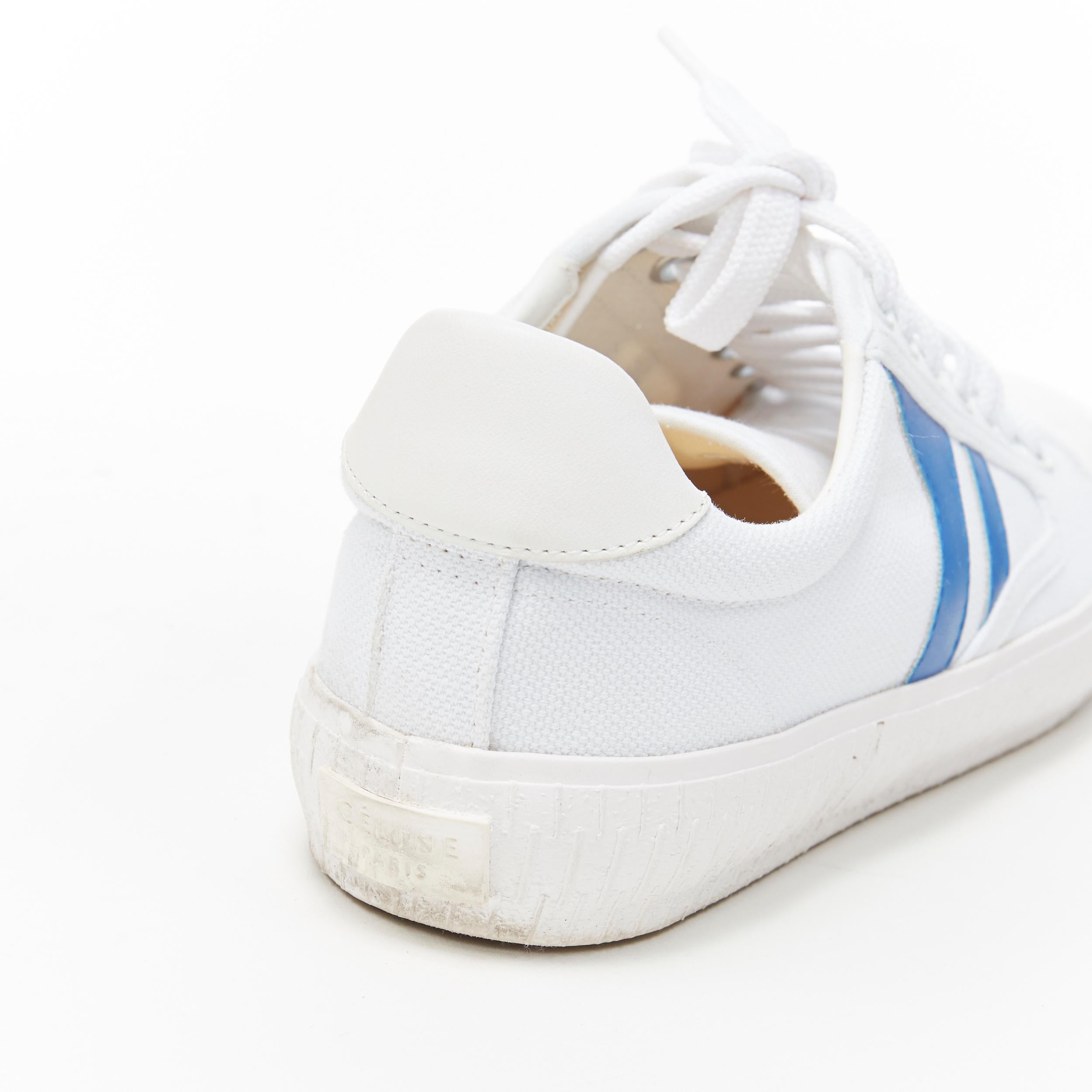 OLD CELINE white blue graphic canvas lace up casusal low top sneakers EU38
Brand: Celine
Designer: Phoebe Philo
Model Name / Style: Low top sneakers
Material: Fabric
Color: White, blue
Pattern: Solid
Closure: Lace up
Extra Detail: Leather insert