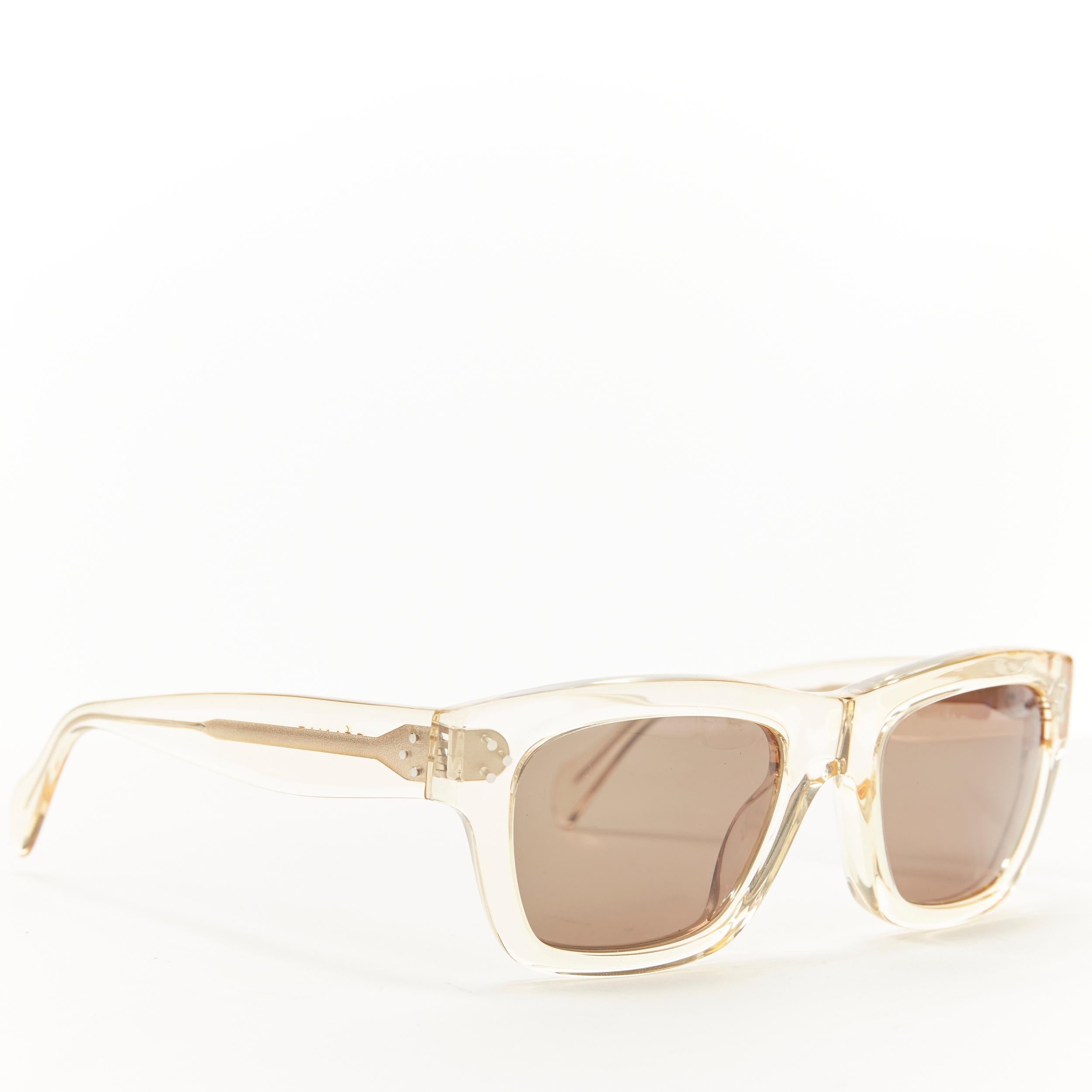 OLD CELINE yellow clear PVC frame grey lens square summer sunglasses 
Reference: AEMA/A00005 
Brand: Celine 
Designer: Phoebe Philo 
Material: Plastic 
Color: Yellow 
Pattern: Solid 
Extra Detail: Yellow tint clear frame. Grey lens. 
Made in: Italy