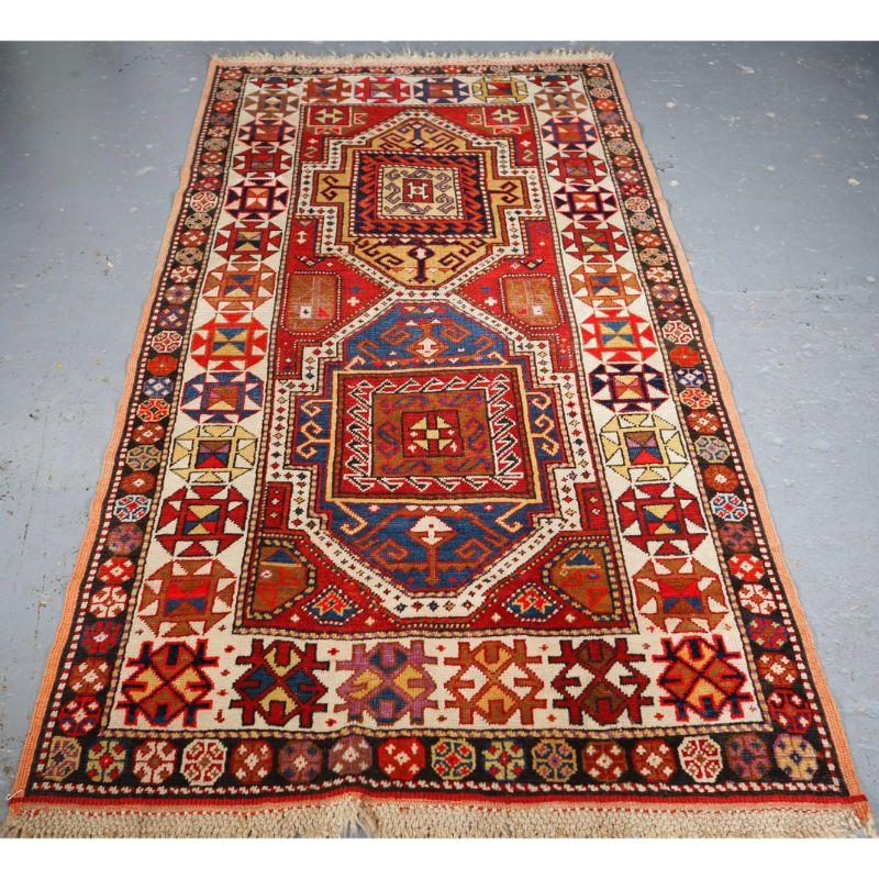 Old Central Anatolian Konya rug with double medallion design.

An attractive Konya rug with a very traditional double medallion design, with one medallion in indigo blue and the other in yellow. The ivory ground border is typical of this region.
