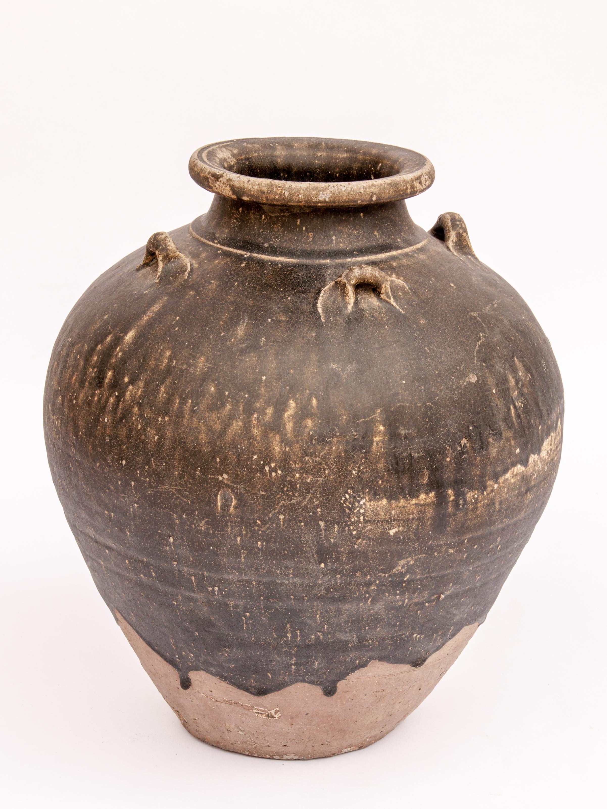 Old Ceramic Jar from North Thailand. 14th - 16th Centuries. 14.75 inches tall.
This jar originates from north Thailand. It is difficult to assign it to a specific kiln, but it is most probably from either one of the Sawankhalok kilns of north /