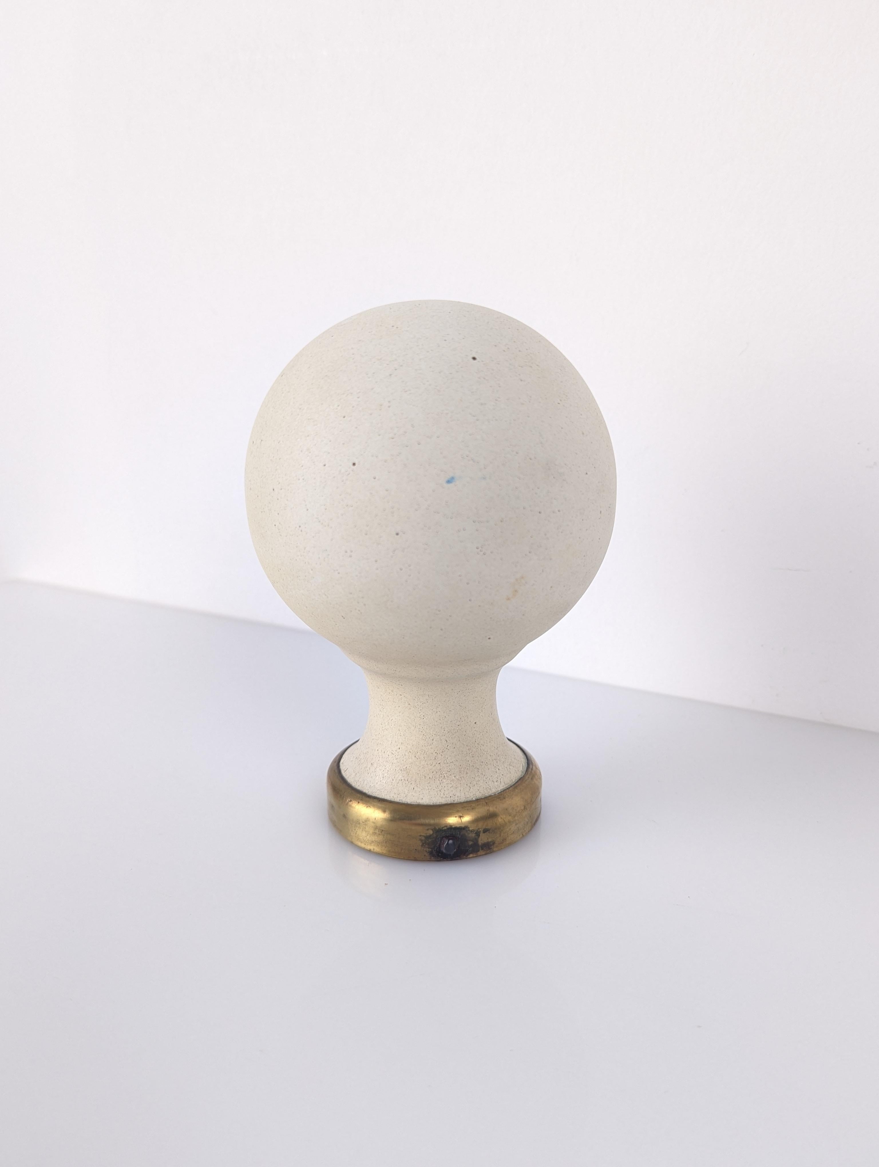 Elegant white ceramic staircase top ball with brass base.