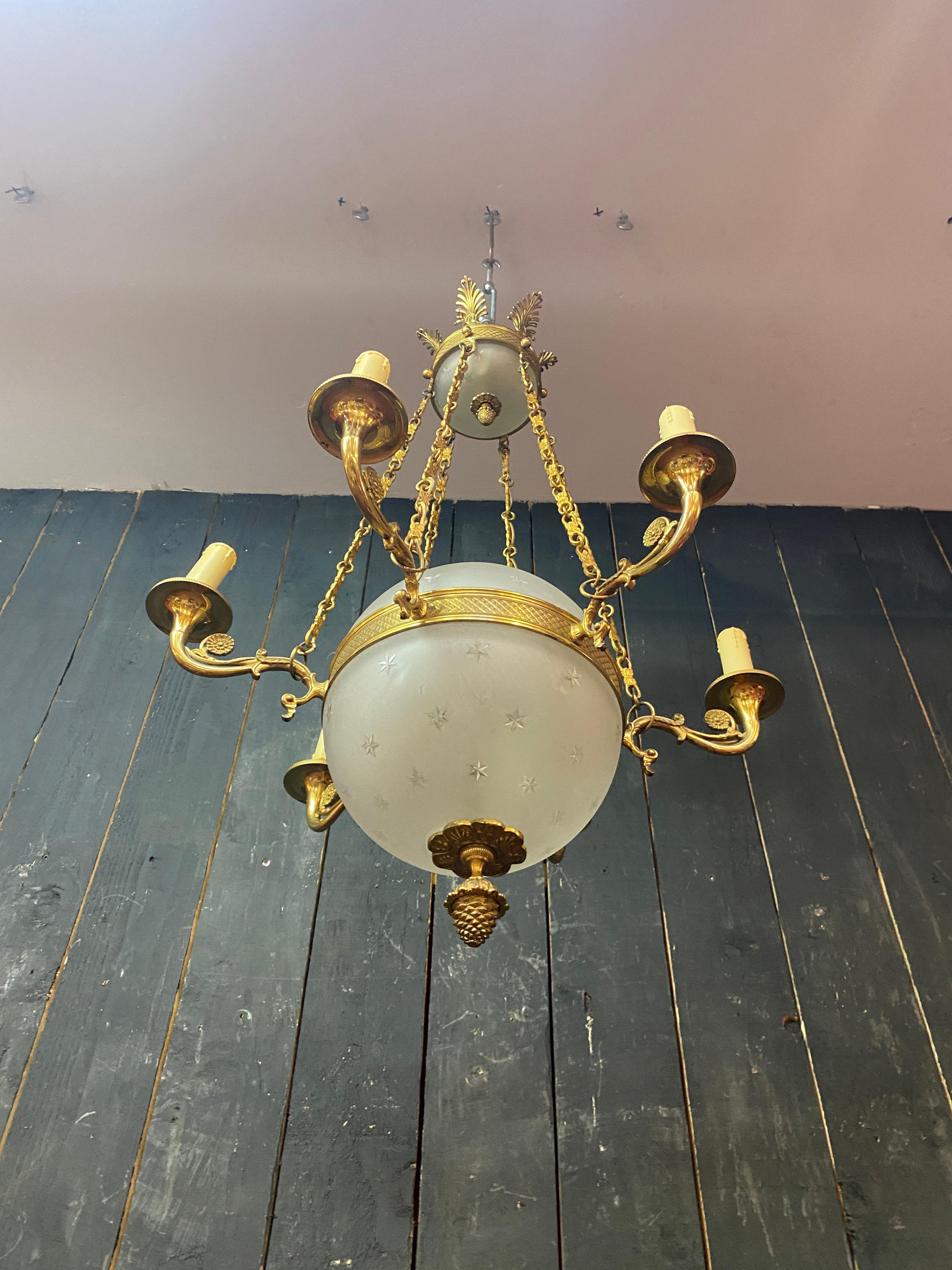 old chandelier in bronze and frosted glass decorated with engraved stars.  For Sale 3
