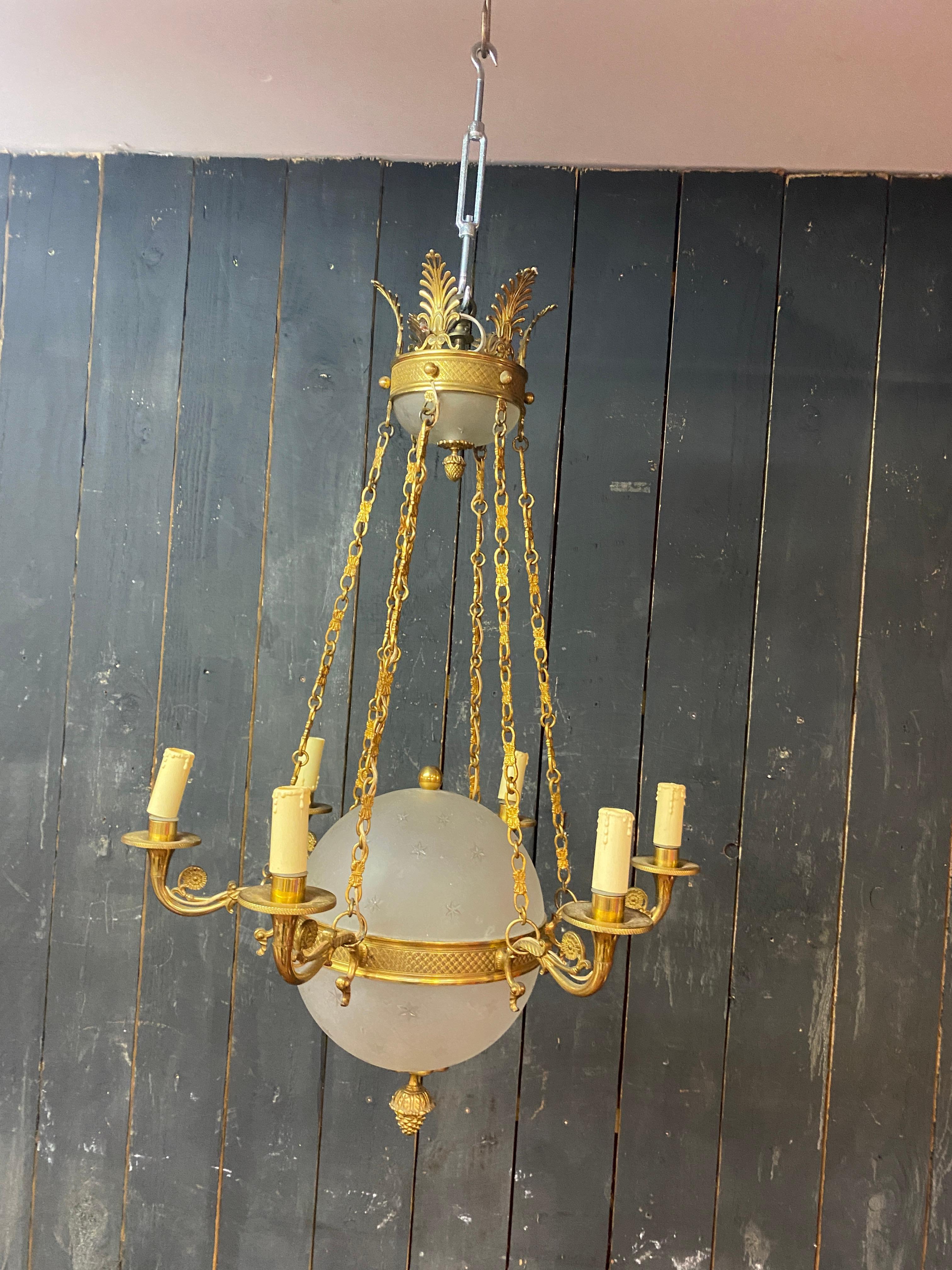 old chandelier in bronze and frosted glass decorated with engraved stars.  For Sale 5