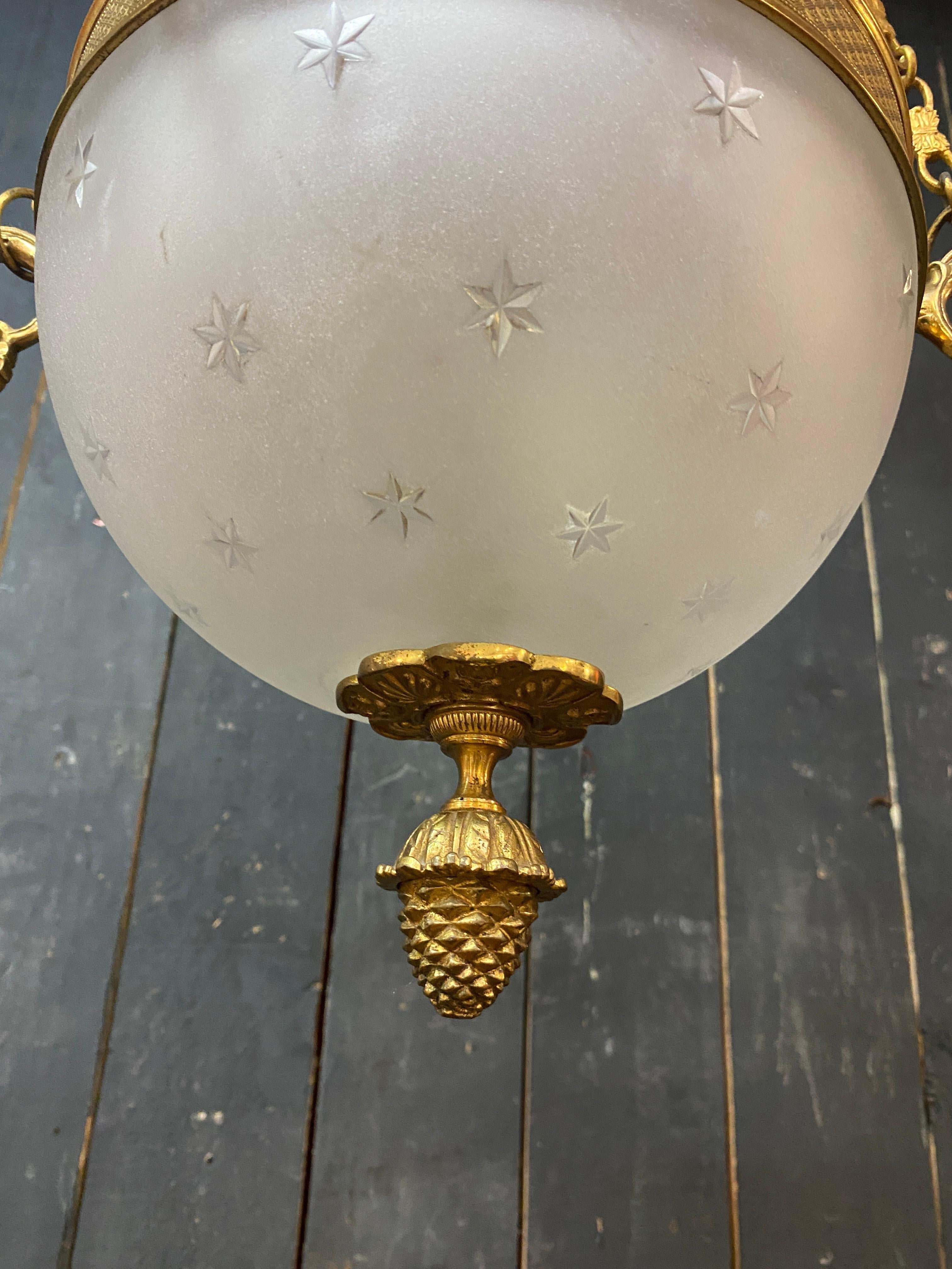 old chandelier in bronze and frosted glass decorated with engraved stars.  For Sale 6